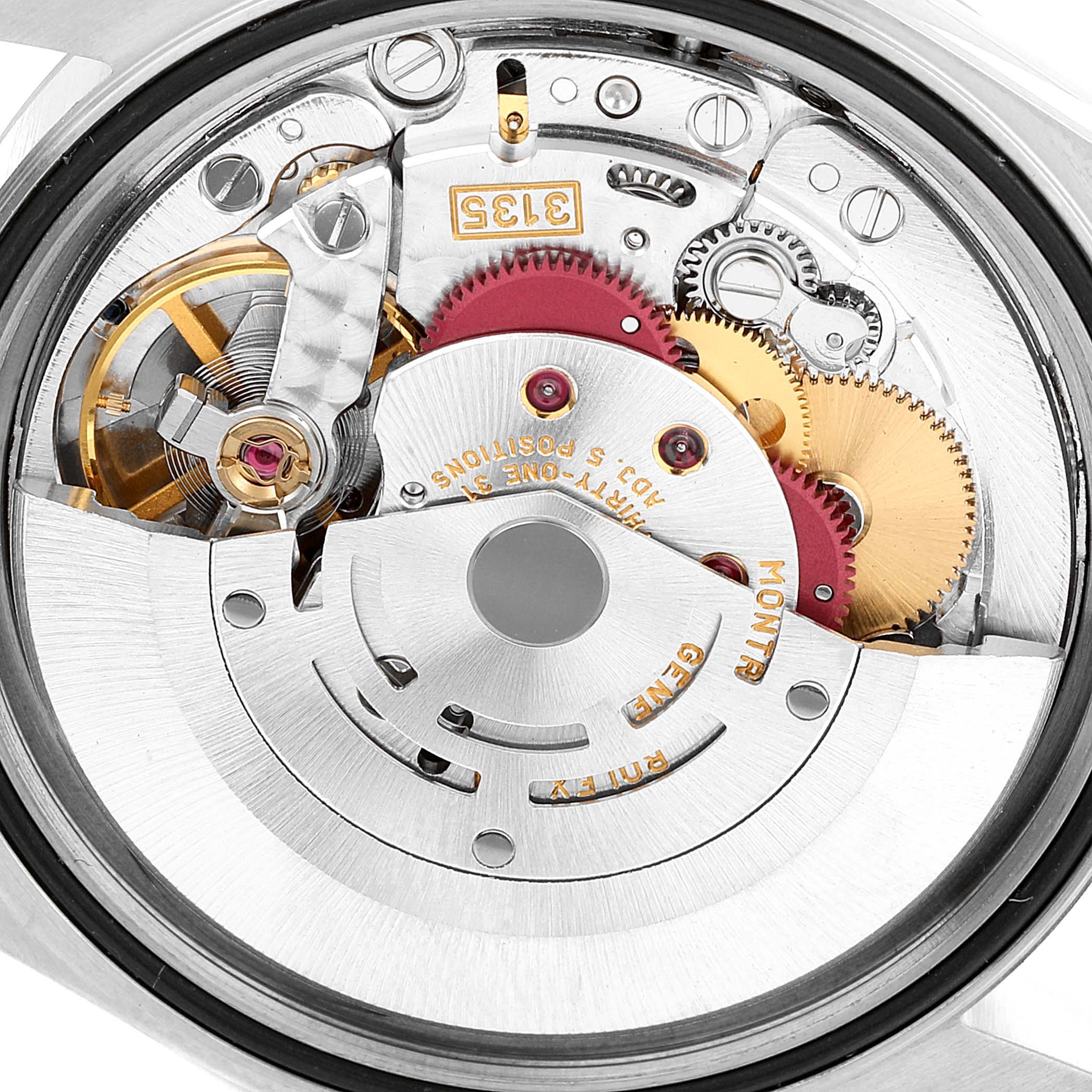 This image shows the intricate inner mechanics of a Rolex Datejust 16234 Men's Stainless Steel Blue Dial 16234 Men's Stainless Steel Blue Dial watch, featuring gears, the balance wheel, and the rotor.