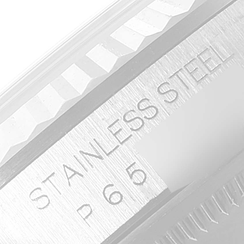 Close-up of the stainless steel casing and fluted bezel of a Rolex Datejust 16234 Men's Stainless Steel Blue Dial 16234 Men's Stainless Steel Blue Dial watch.