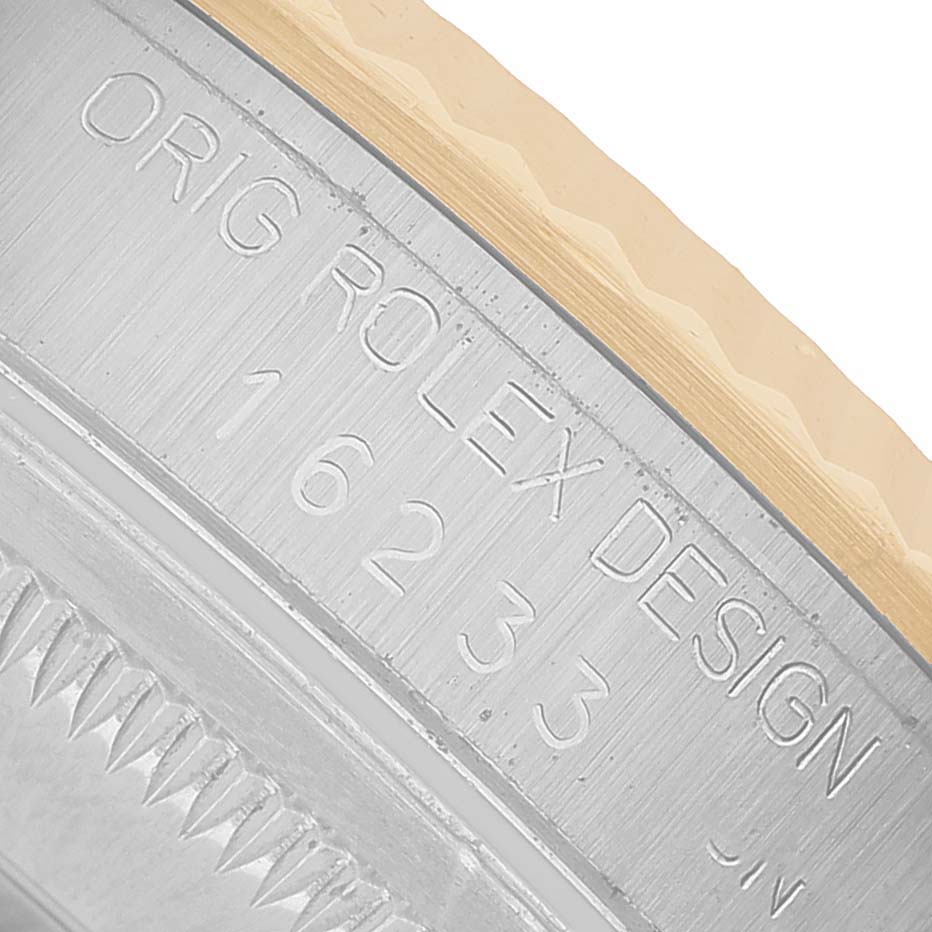 The image shows a close-up of the side engraving on a Rolex Datejust 16233 Men's Stainless Steel Champagne Dial, detailing the model number "16233."
