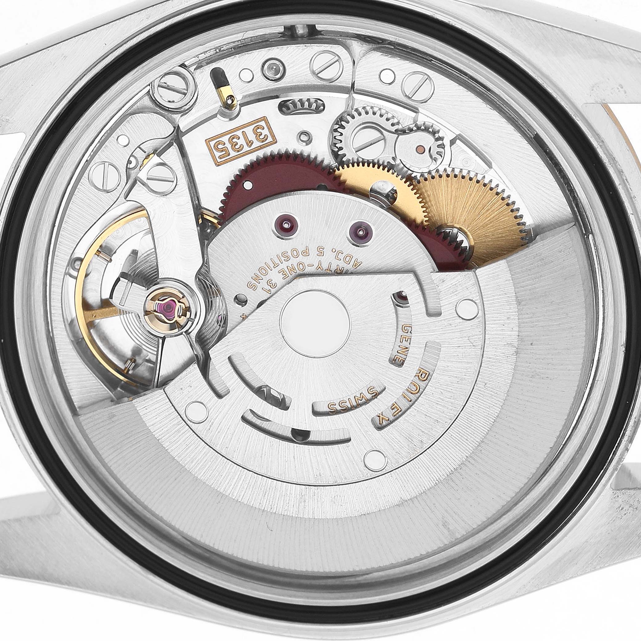 The image shows the movement of a Rolex Datejust 16233 Men's Stainless Steel Champagne Dial watch from a back view, highlighting gears and intricate components.