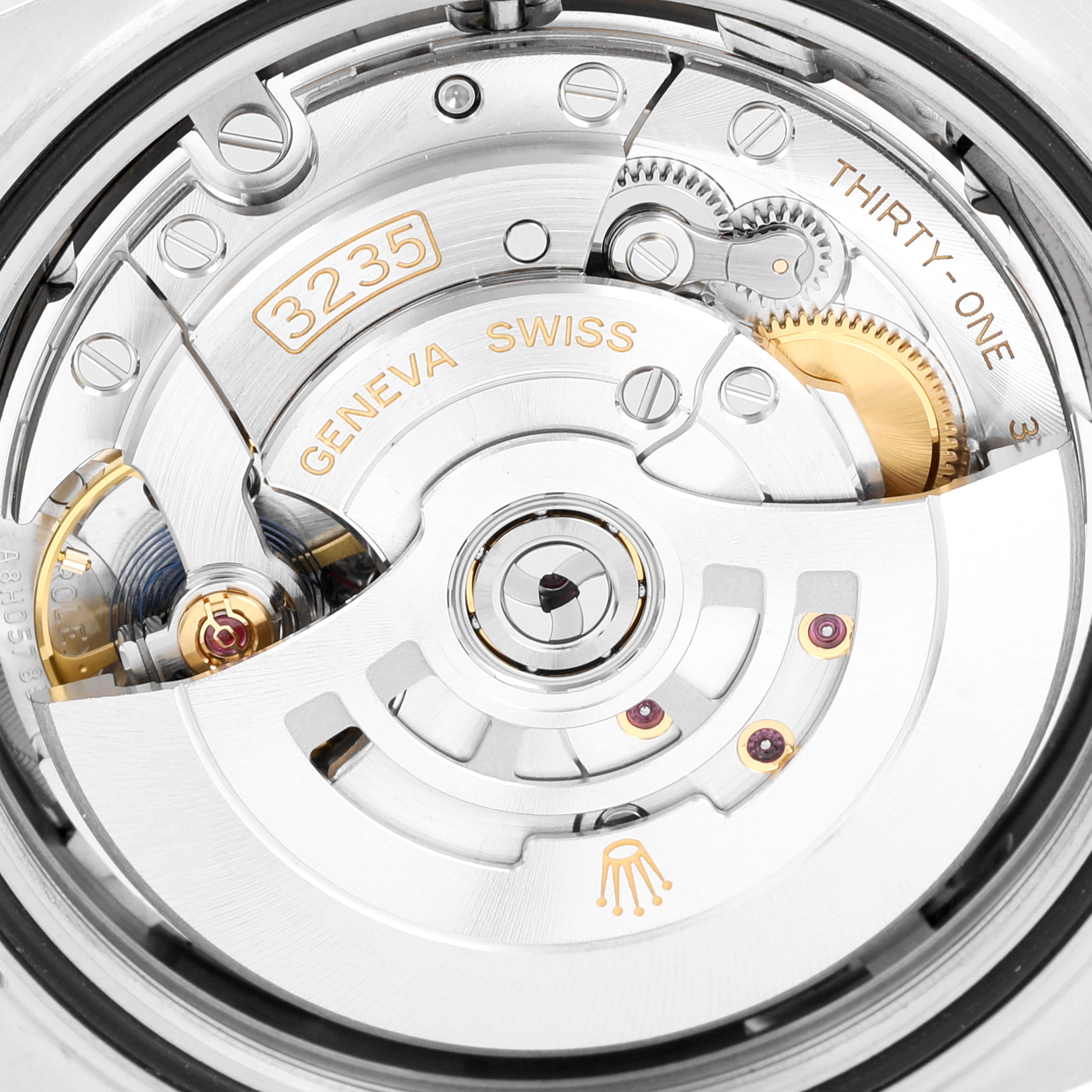 The image shows a close-up of the movement mechanism of the Rolex Datejust 41 126300 Men's Stainless Steel Grey Dial 126300 Men's Stainless Steel Grey Dial watch, highlighting gears and the rotor.