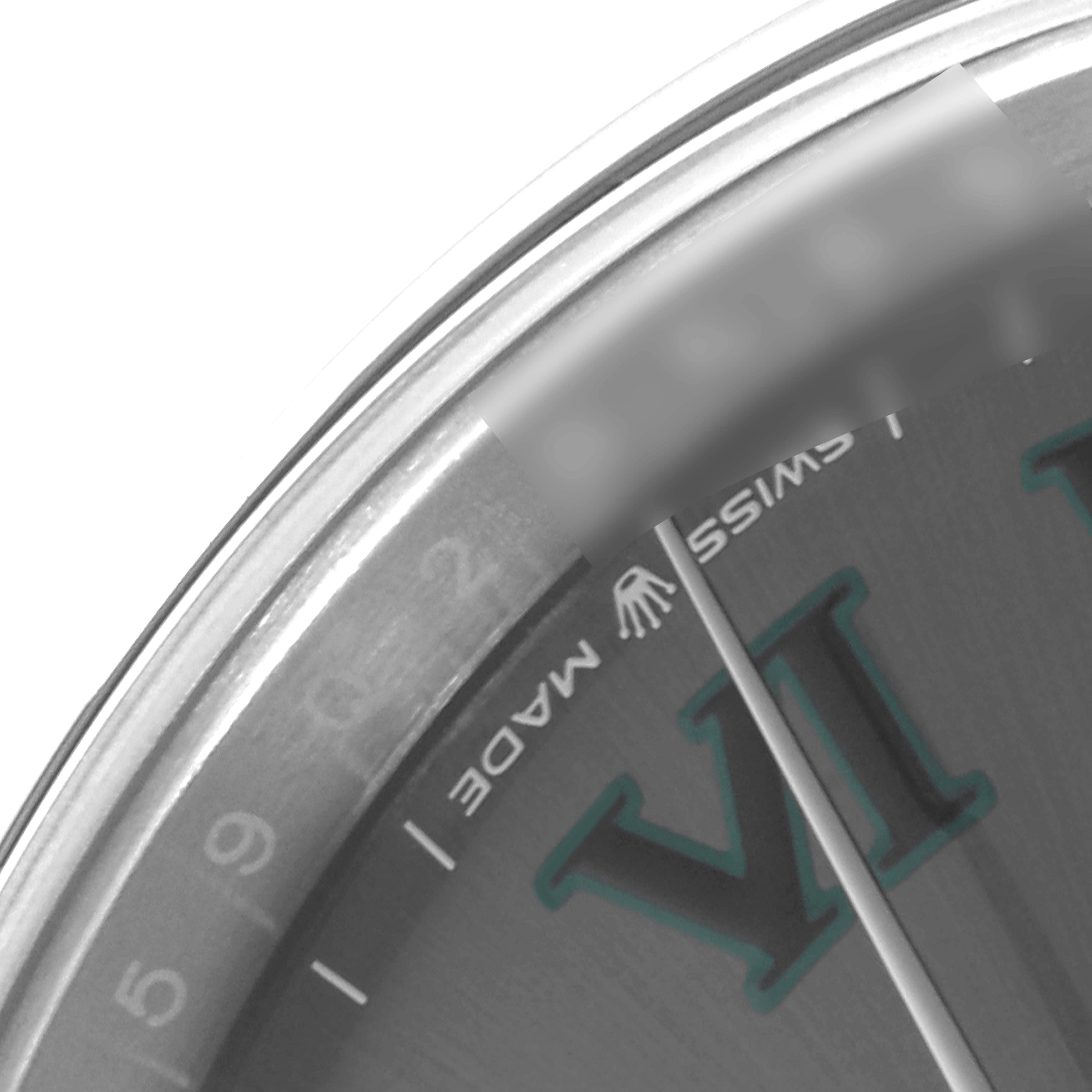 This close-up of the Rolex Datejust 41 126300 Men's Stainless Steel Grey Dial 126300 Men's Stainless Steel Grey Dial watch shows part of the dial, the VI numeral, and part of the bezel.