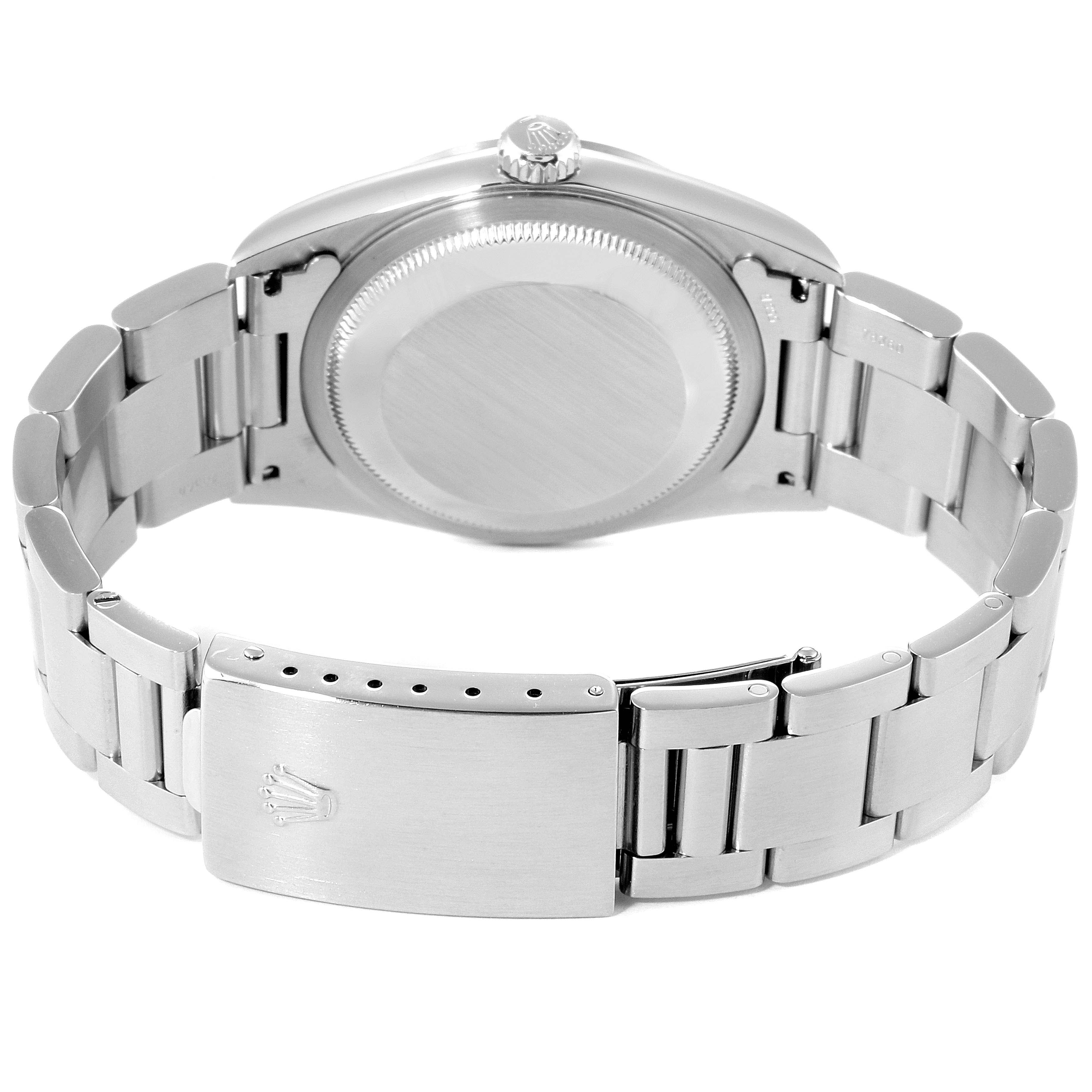 The image shows the backside of a Rolex Datejust 16200 Men's Stainless Steel Black Dial 16200 Men's Stainless Steel Black Dial watch, highlighting its clasp, bracelet, and case back.