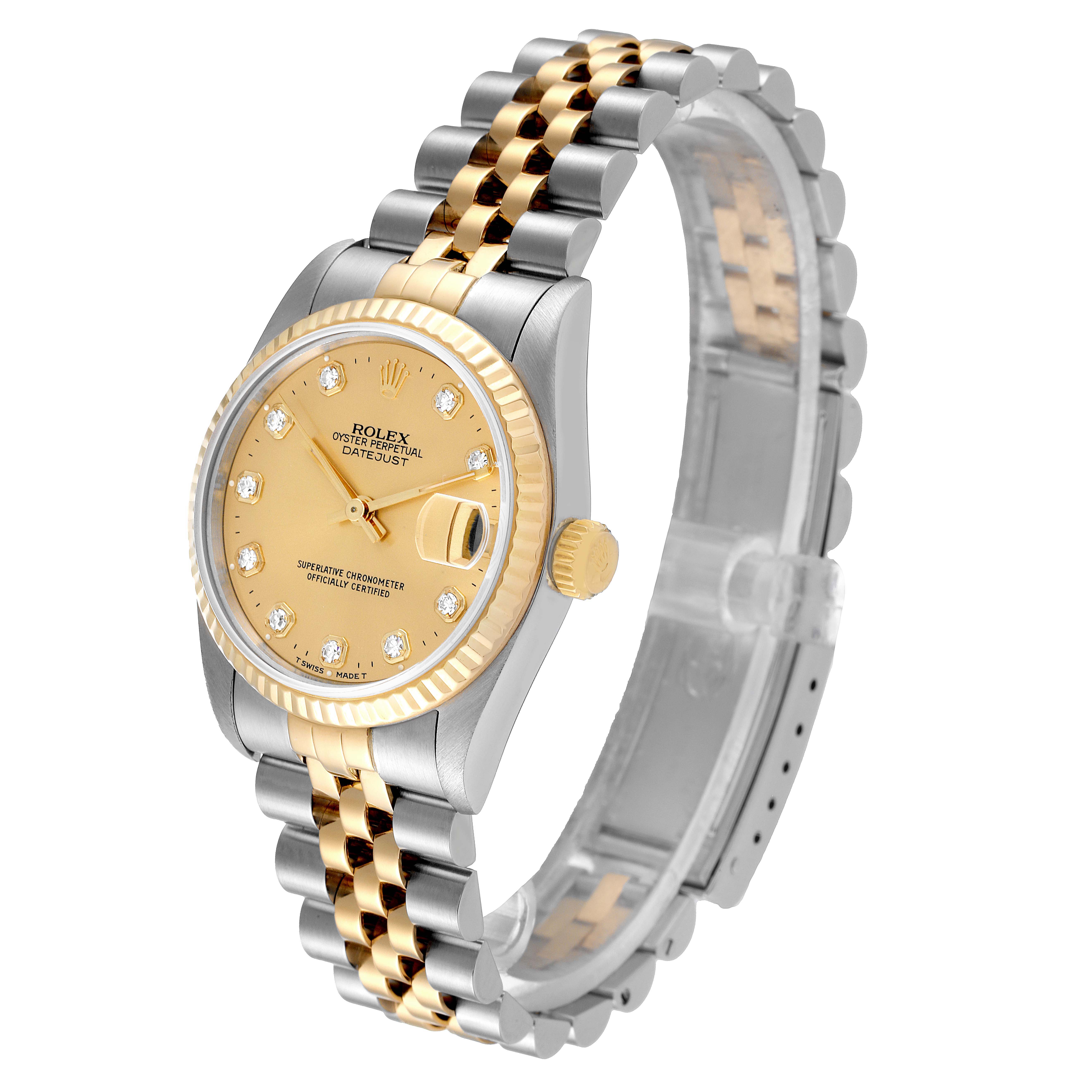 The Rolex Mid-Size 68273 Women
s Steel and Gold (two tone) Champagne Dial 68273 Women
s Steel and Gold (two tone) Champagne Dial model is shown at an angled side view, highlighting its gold bezel, gold dial, and two-tone bracelet.