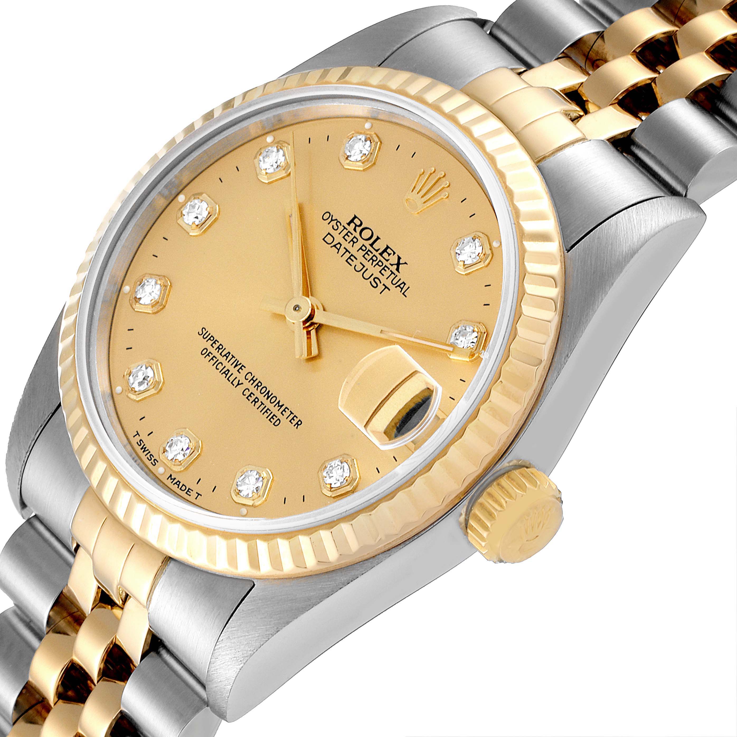 This image shows a Rolex Mid-Size 68273 Women
s Steel and Gold (two tone) Champagne Dial 68273 Women
s Steel and Gold (two tone) Champagne Dial model watch from an angled view, highlighting the face, dial, bezel, and part of the bracelet.