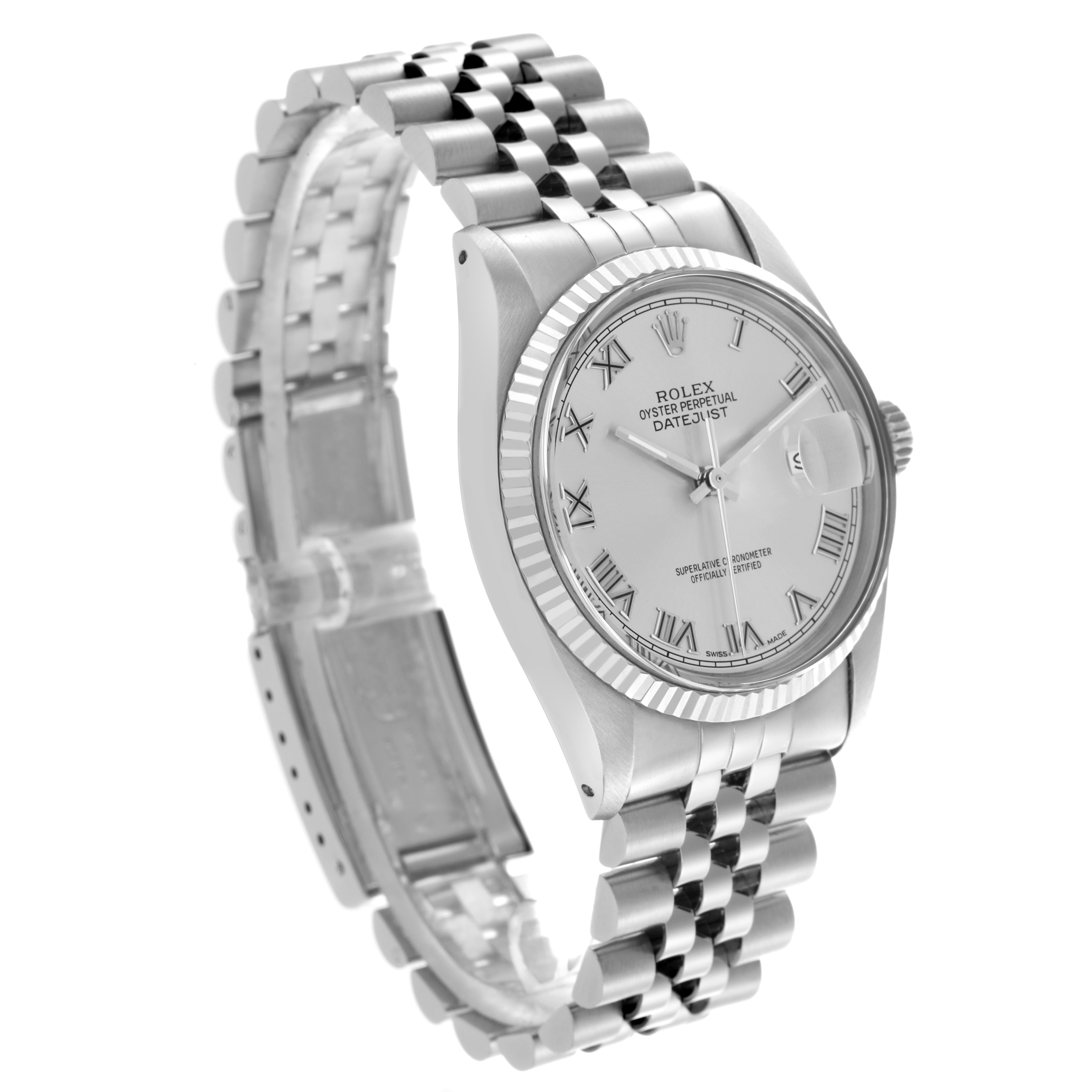 The Rolex Datejust 16014 Men
s Stainless Steel Silver Dial 16014 Men
s Stainless Steel Silver Dial watch is shown at an angled side view, highlighting its dial, fluted bezel, and Jubilee bracelet.
