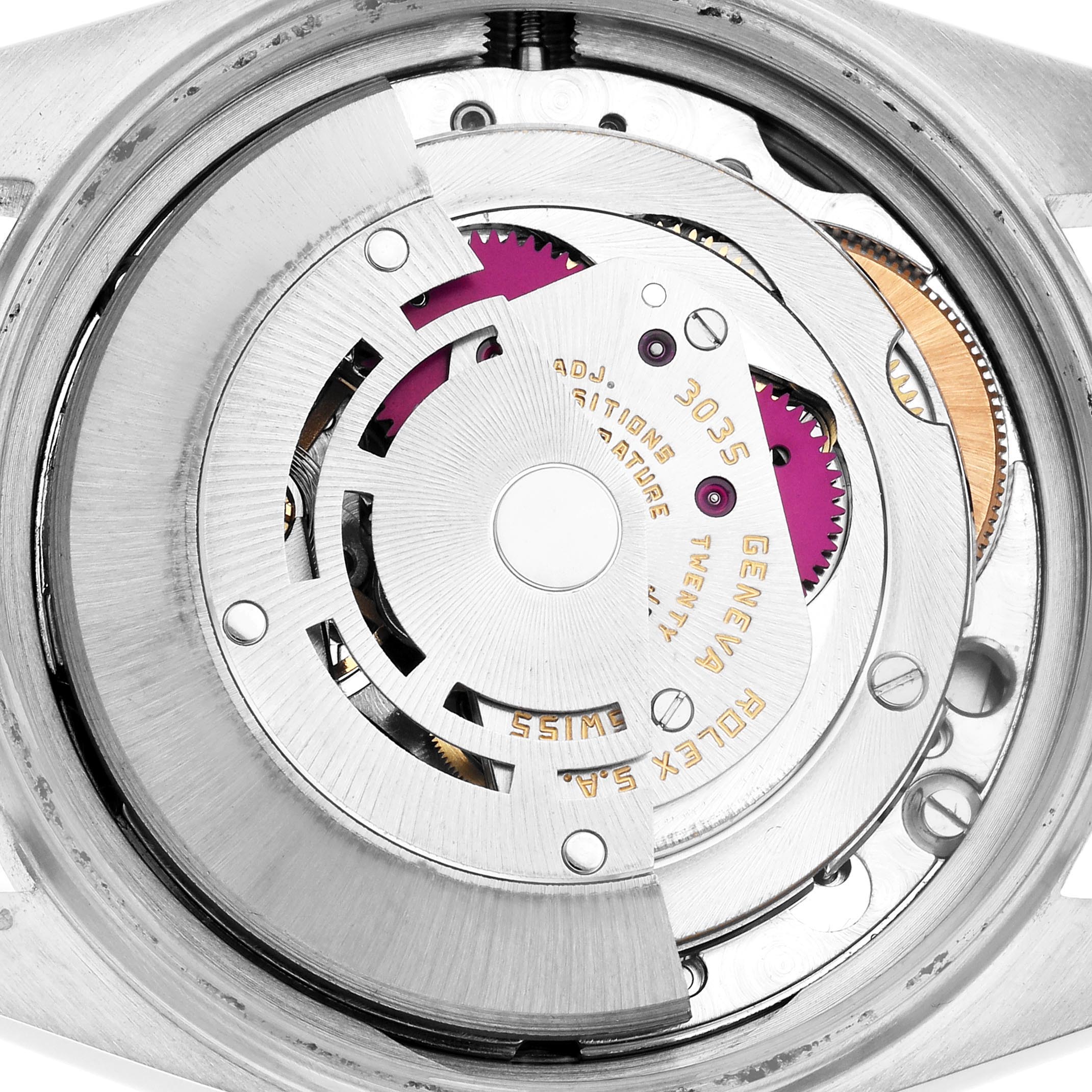 The image shows the movement of a Rolex Datejust 16014 Men
s Stainless Steel Silver Dial 16014 Men
s Stainless Steel Silver Dial watch from a top angle, highlighting its intricate mechanism.