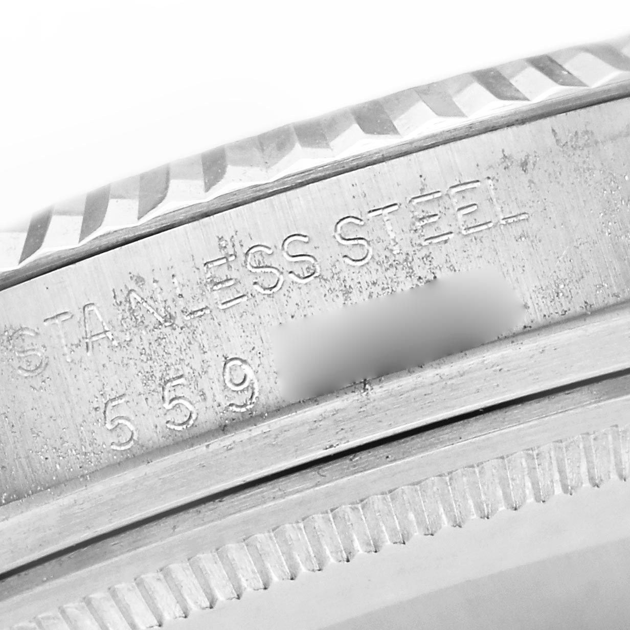The image shows a close-up of the case side of a Rolex Datejust 16014 Men
s Stainless Steel Silver Dial 16014 Men
s Stainless Steel Silver Dial, highlighting the stainless steel engraving.