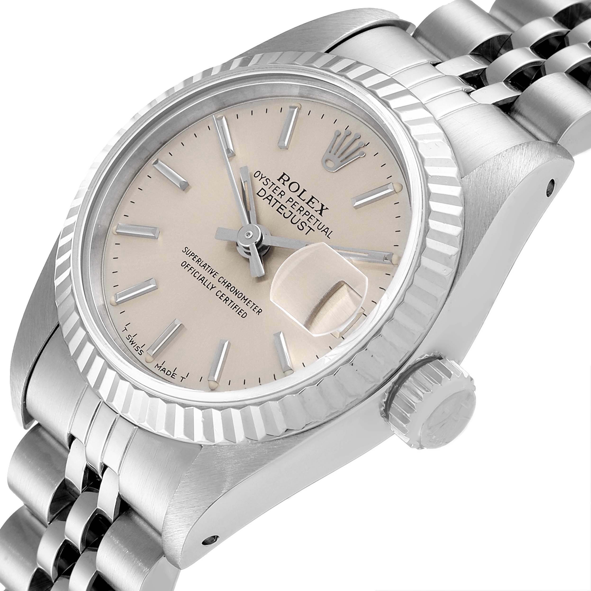 This is a close-up angle of the Rolex Datejust 69174 Women
s Stainless Steel Silver Dial 69174 Women
s Stainless Steel Silver Dial watch showing the face, crown, bezel, and part of the bracelet.