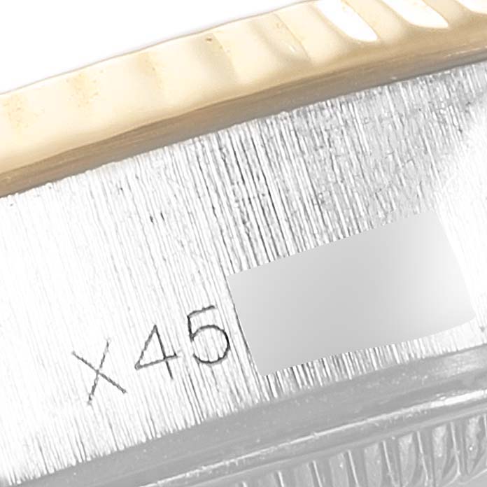 This close-up image shows part of the bezel and case with engraved numbers of a Rolex Datejust 69173 Women
s Steel and Gold (two tone) Champagne Dial 69173 Women
s Steel and Gold (two tone) Champagne Dial watch.