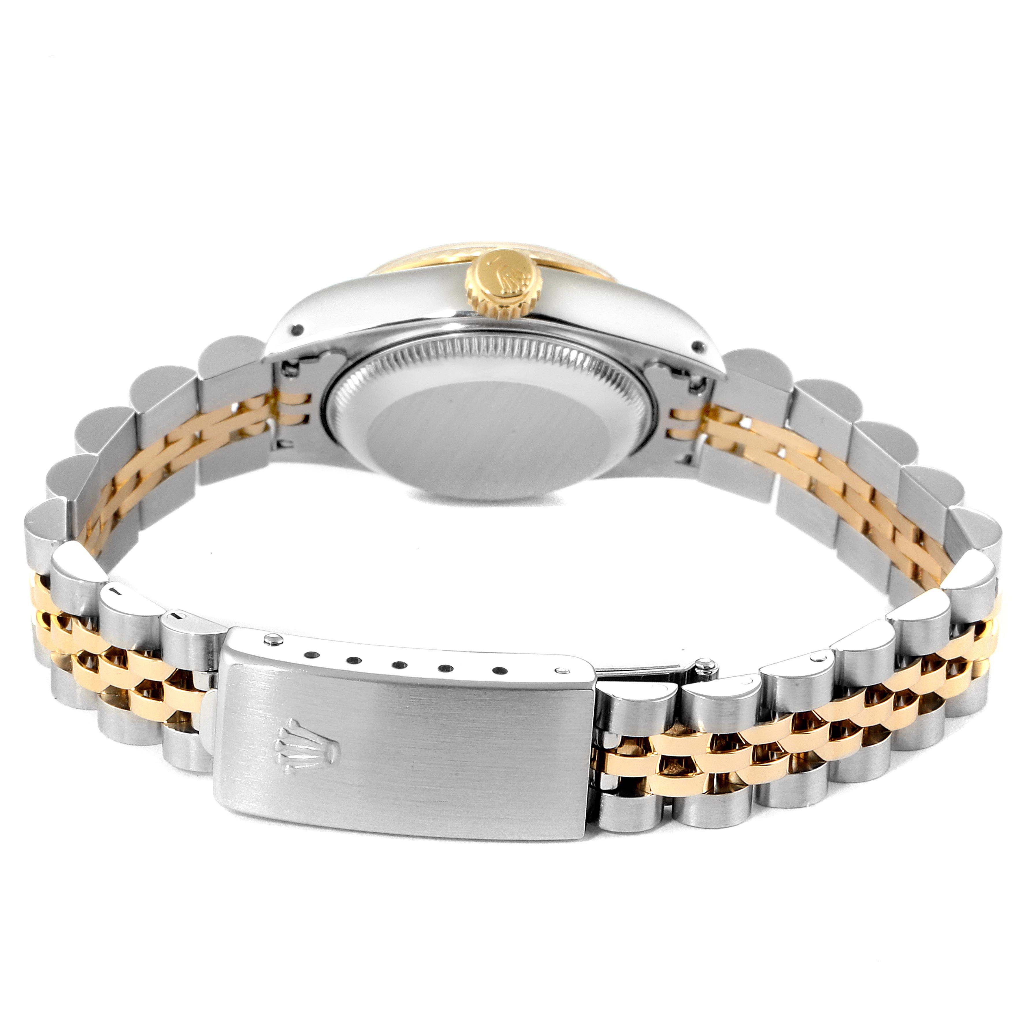 The image shows the back view of a Rolex Datejust 69173 Women
s Steel and Gold (two tone) Champagne Dial 69173 Women
s Steel and Gold (two tone) Champagne Dial watch, highlighting its case back, crown, and the two-tone jubilee bracelet with clasp.