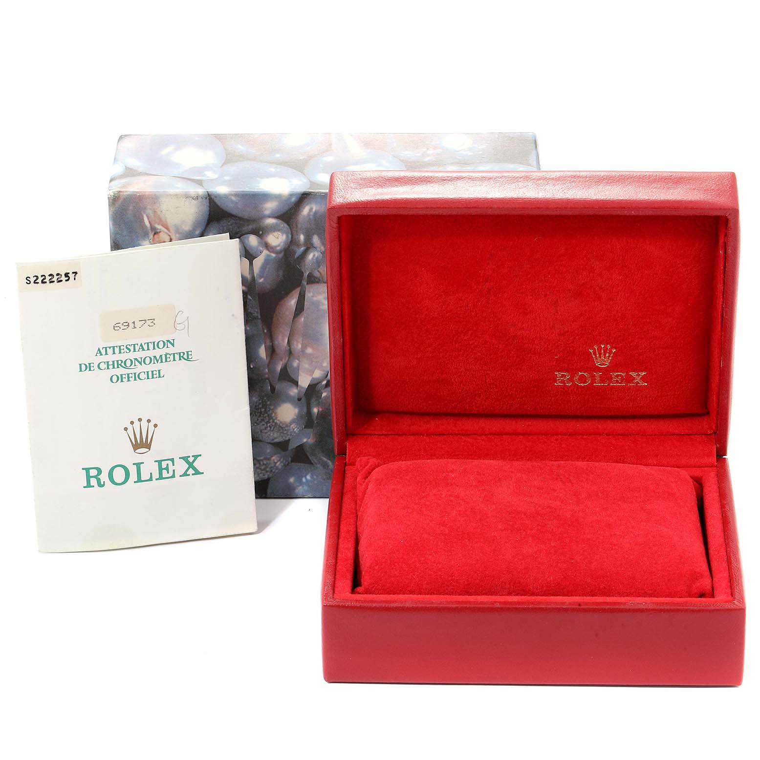 The image shows a red Rolex box with the Datejust model and an official chronometer certification card.