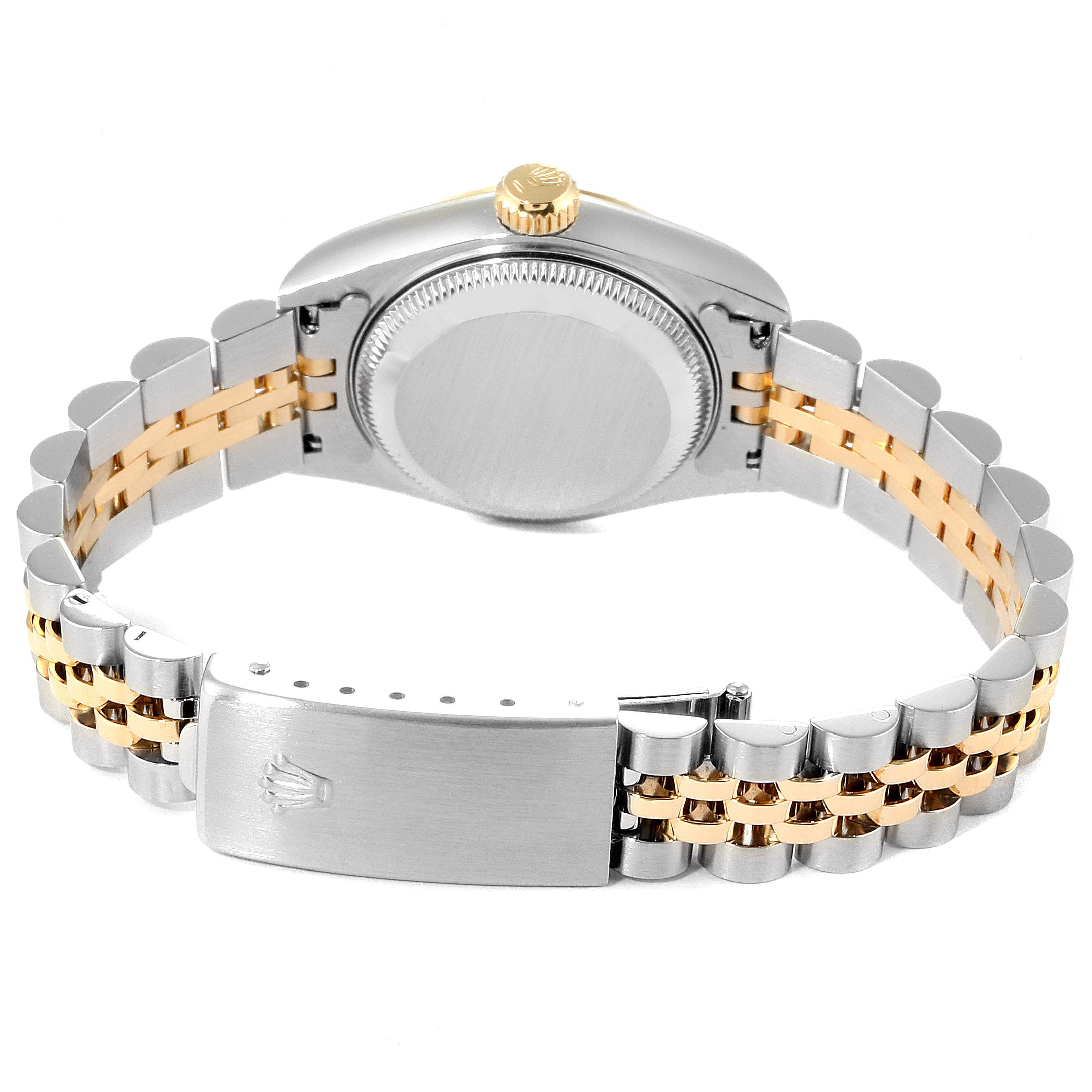This image shows the rear view of the Rolex Datejust 69173 Women
s Steel and Gold (two tone) White Dial 69173 Women
s Steel and Gold (two tone) White Dial watch, highlighting its case back, crown, and two-tone bracelet clasp.