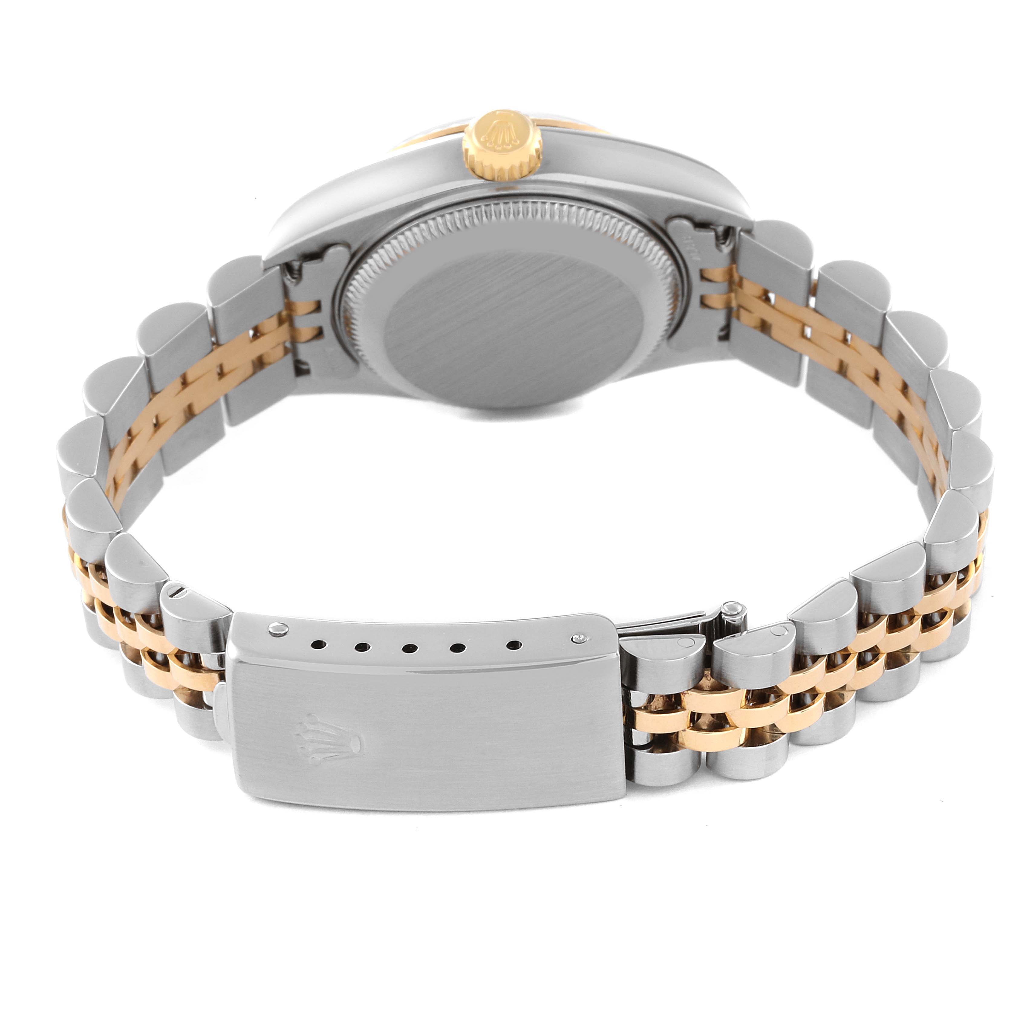 The image shows the backside and clasp of a Rolex Datejust 79173 Women's Steel and Gold (two tone) Silver Dial 79173 Women's Steel and Gold (two tone) Silver Dial watch, highlighting the two-tone bracelet and crown.