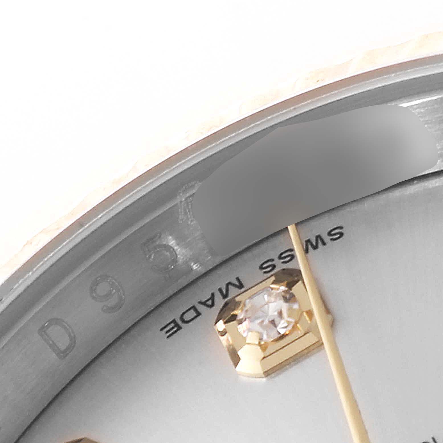This image shows a close-up of the dial, bezel, and a diamond hour marker of a Rolex Datejust 116233 Men's Steel and Gold (two tone) Silver Dial 116233 Men's Steel and Gold (two tone) Silver Dial watch.