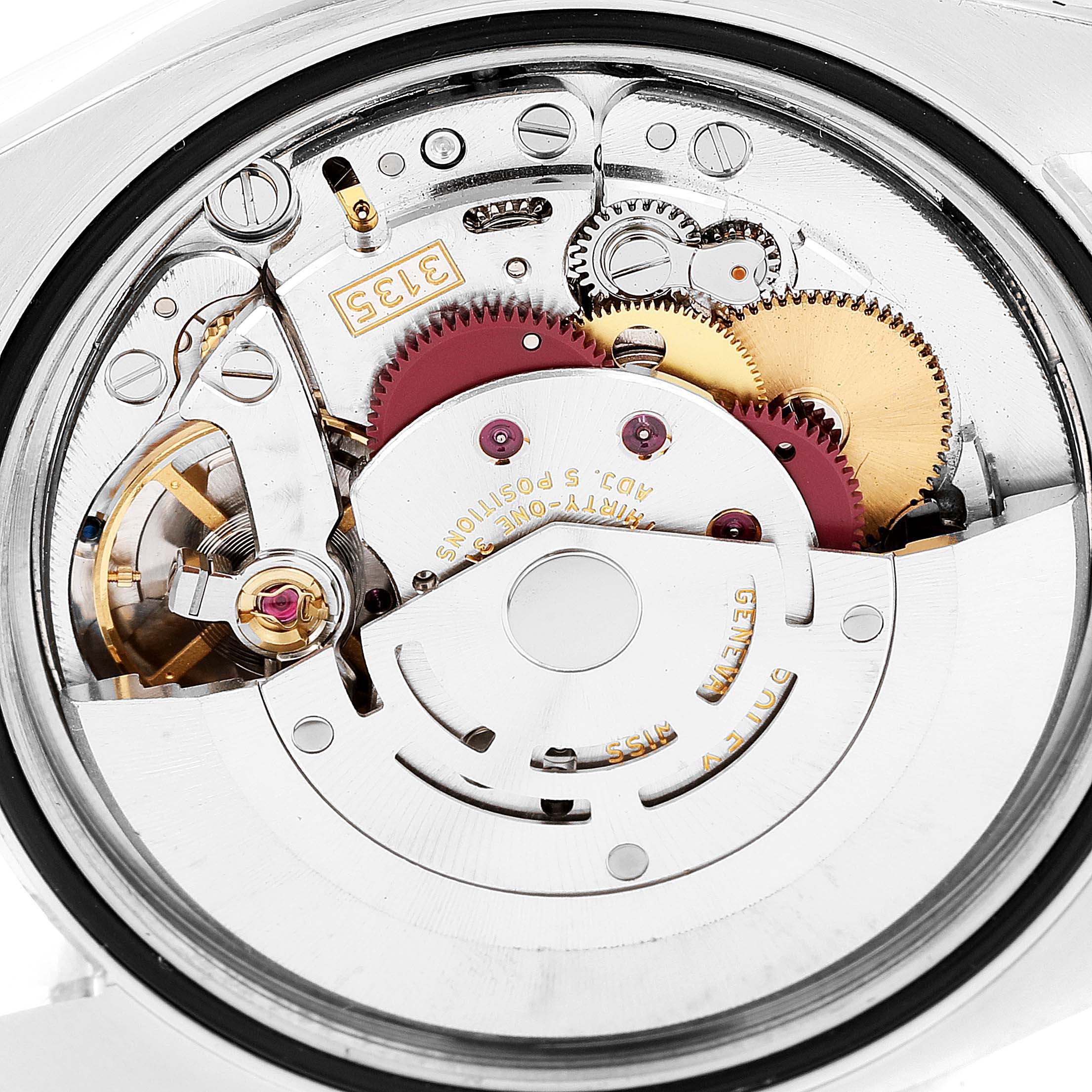 The image shows a close-up of the movement mechanism of a Rolex Datejust 116233 Men's Steel and Gold (two tone) Silver Dial 116233 Men's Steel and Gold (two tone) Silver Dial model.