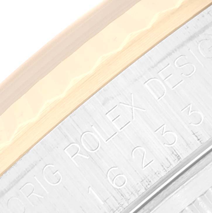 The image shows a close-up of the bezel and case side of a Rolex Datejust 16233 Men's Steel and Gold (two tone) White Dial 16233 Men's Steel and Gold (two tone) White Dial watch, highlighting the engraved model number and "ORIG ROLEX DESIGN".