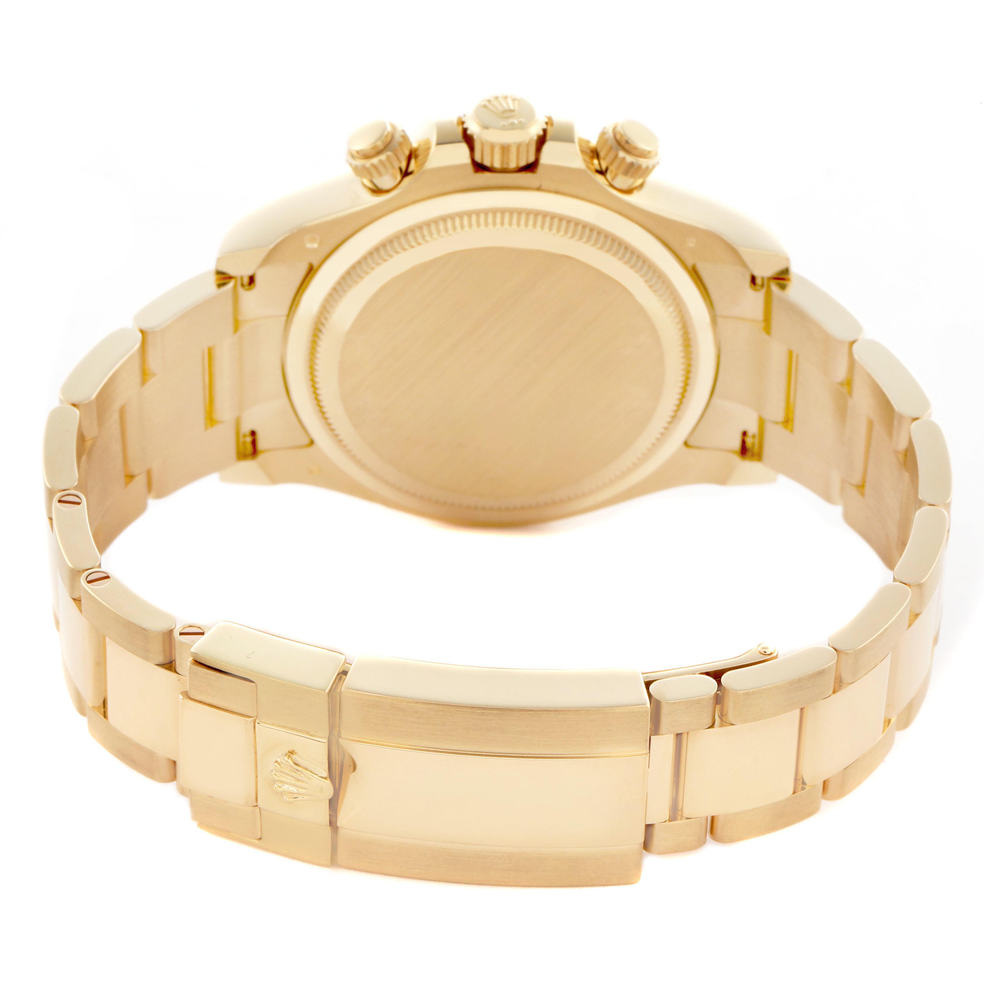 The image shows the back view of a Rolex Daytona 126508 Men
s Yellow Gold Black Dial 126508 Men
s Yellow Gold Black Dial, highlighting the bracelet, clasp, case back, and side crown.