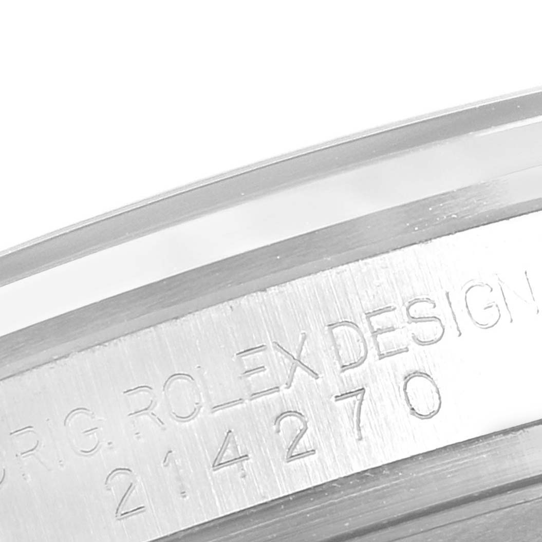 This image shows an angled close-up of the Rolex Explorer 214270 Men's Stainless Steel Black Dial 214270 Men's Stainless Steel Black Dial’s engraved case back with the model number 214270.