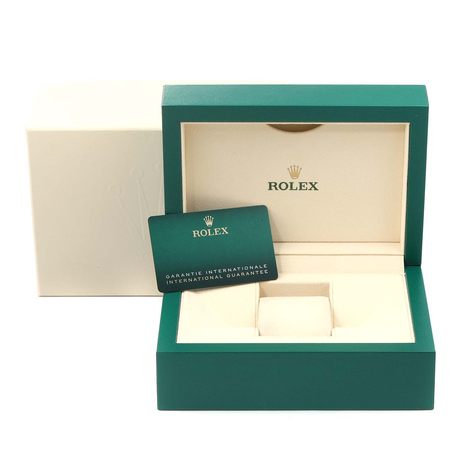 The image shows an open green Rolex watch box and an international guarantee card, associated with the Explorer model.