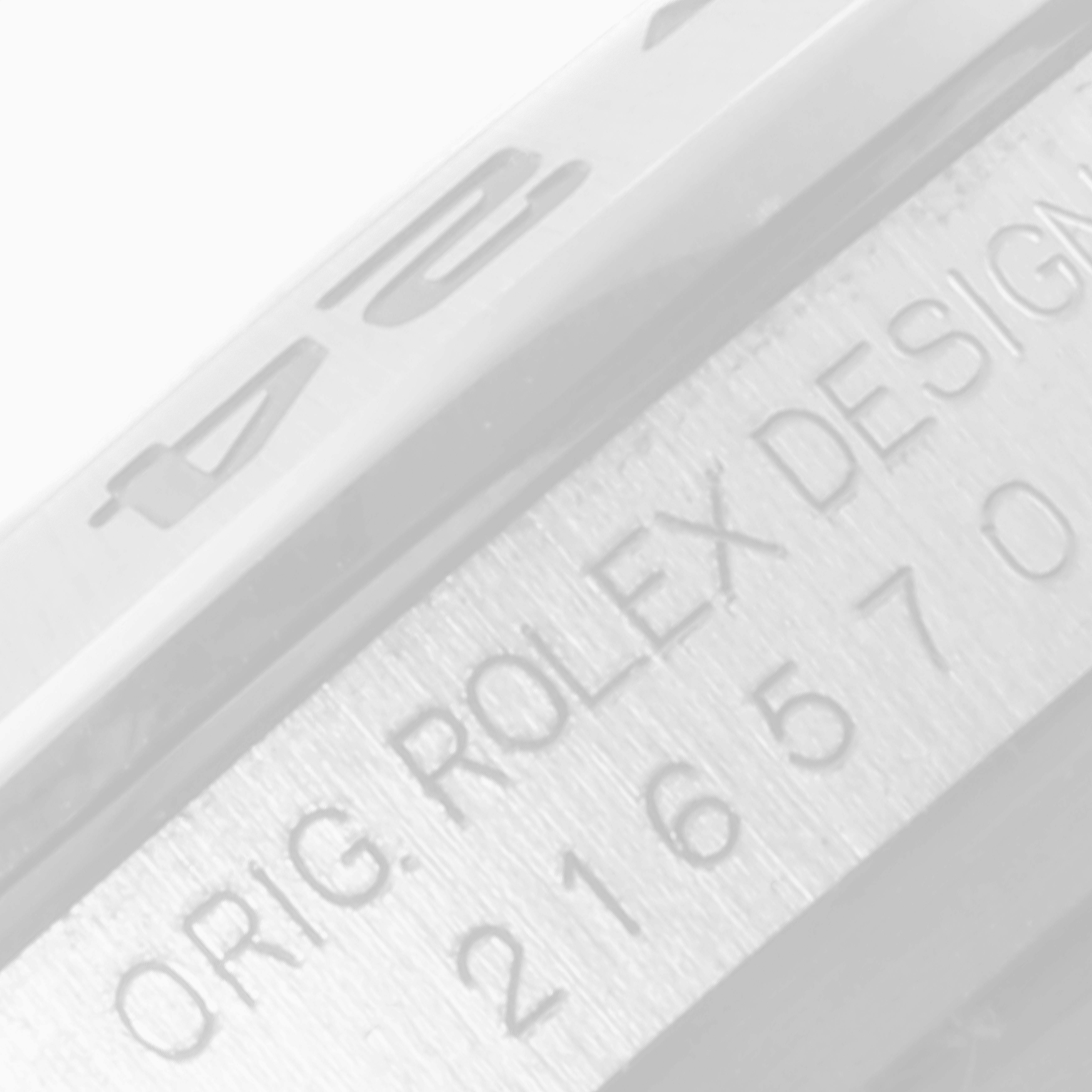 The image shows a close-up of the case side of the Rolex Explorer 216570 Men
s Stainless Steel Black Dial 216570 Men
s Stainless Steel Black Dial, featuring the model
s engraved markings.