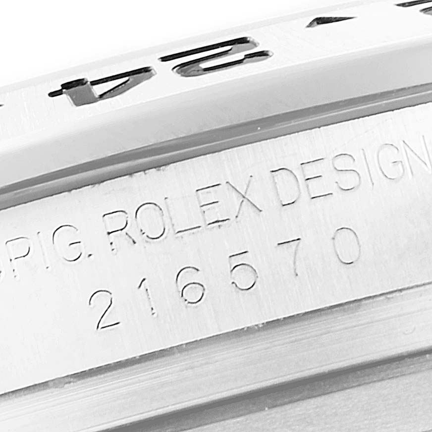 Close-up view of the side of the Rolex Explorer 216570 Men
s Stainless Steel White Dial 216570 Men
s Stainless Steel White Dial showing the model number engraving and part of the bezel with markings.