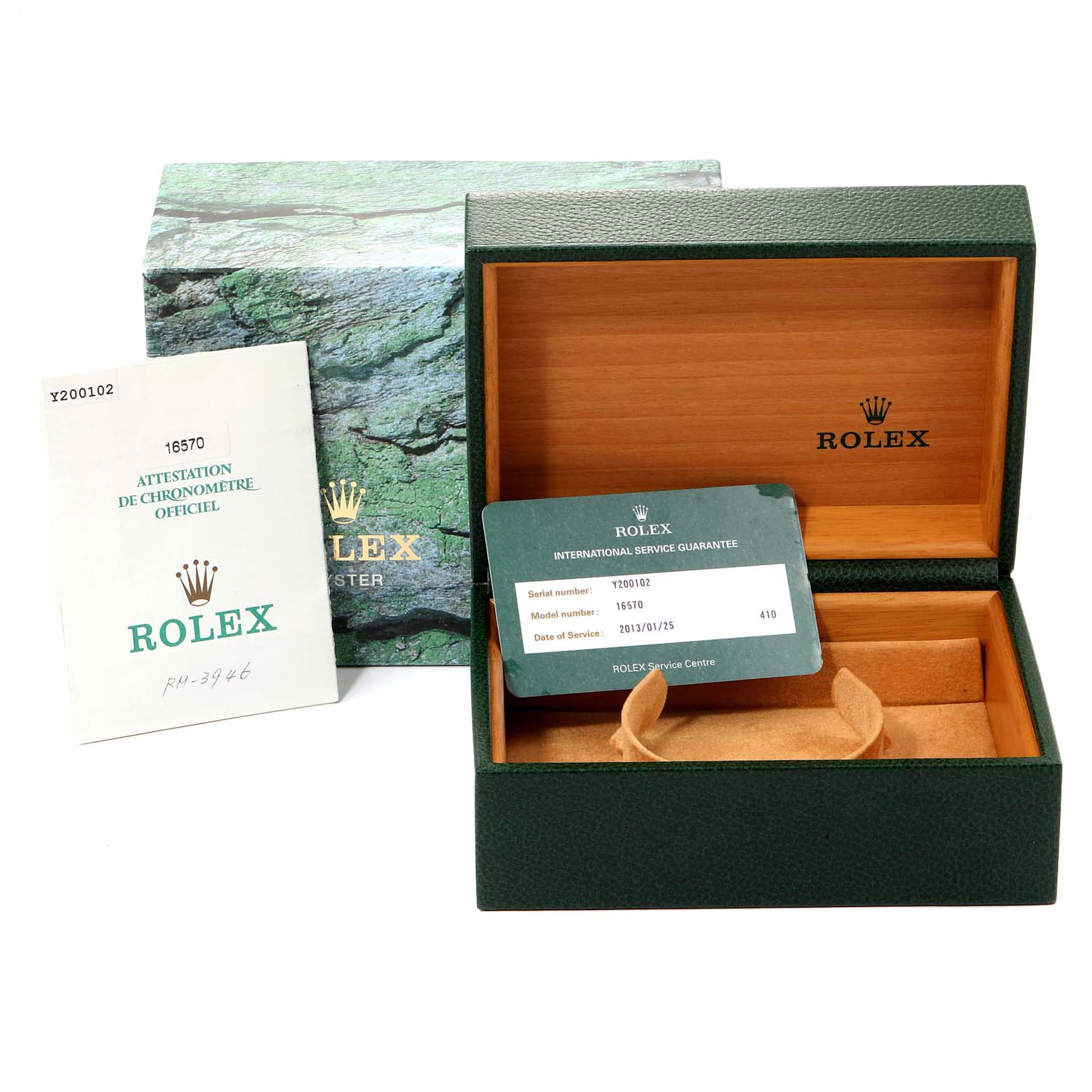The image shows the box, manual, and service guarantee card for a Rolex Explorer 16570  Men
s Stainless Steel Black Dial 16570  Men
s Stainless Steel Black Dial watch, with the box being open.