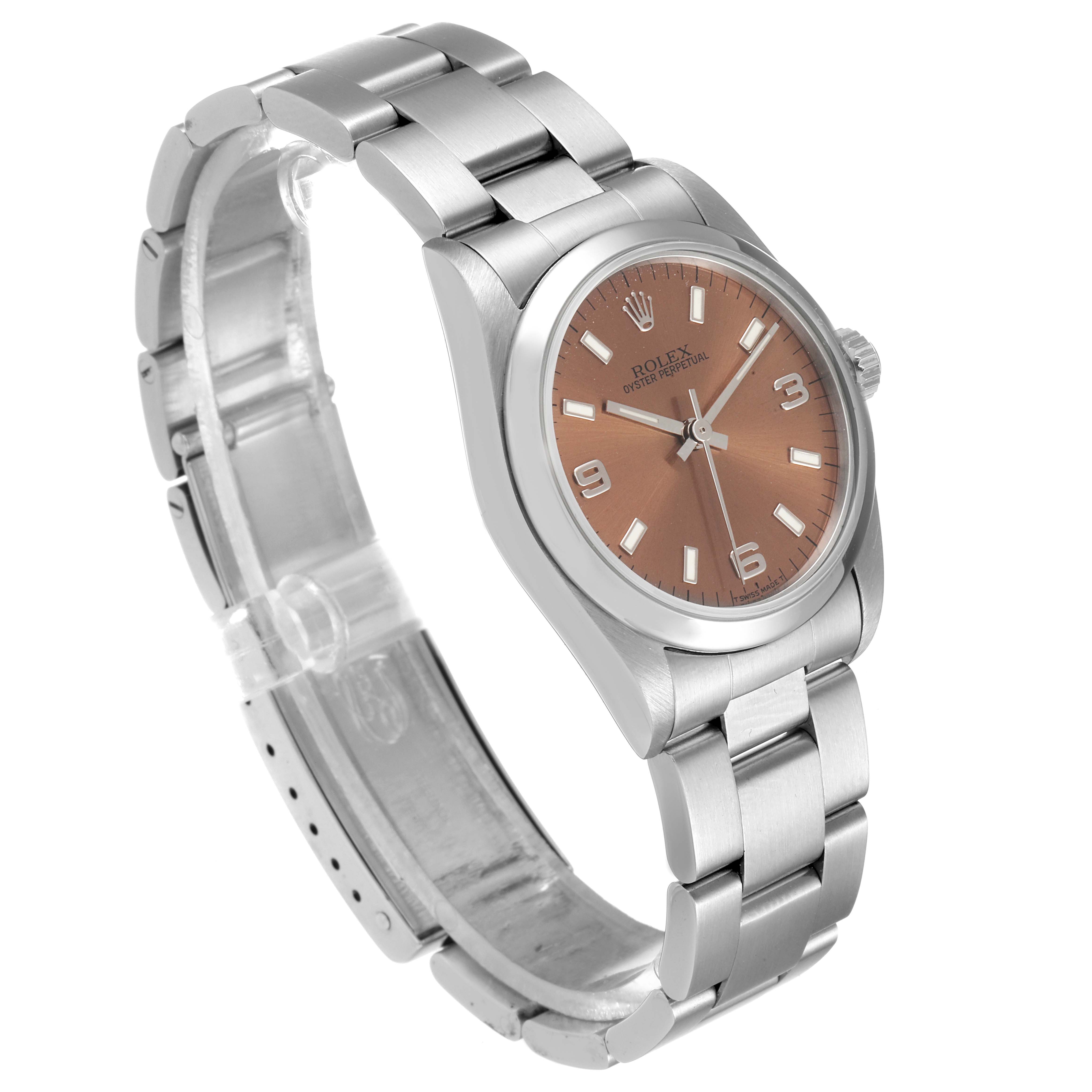 The Rolex Mid-Size 67480 Women
s Stainless Steel Pink Dial 67480 Women
s Stainless Steel Pink Dial watch is shown from a three-quarter angle, highlighting its dial, bezel, and bracelet.