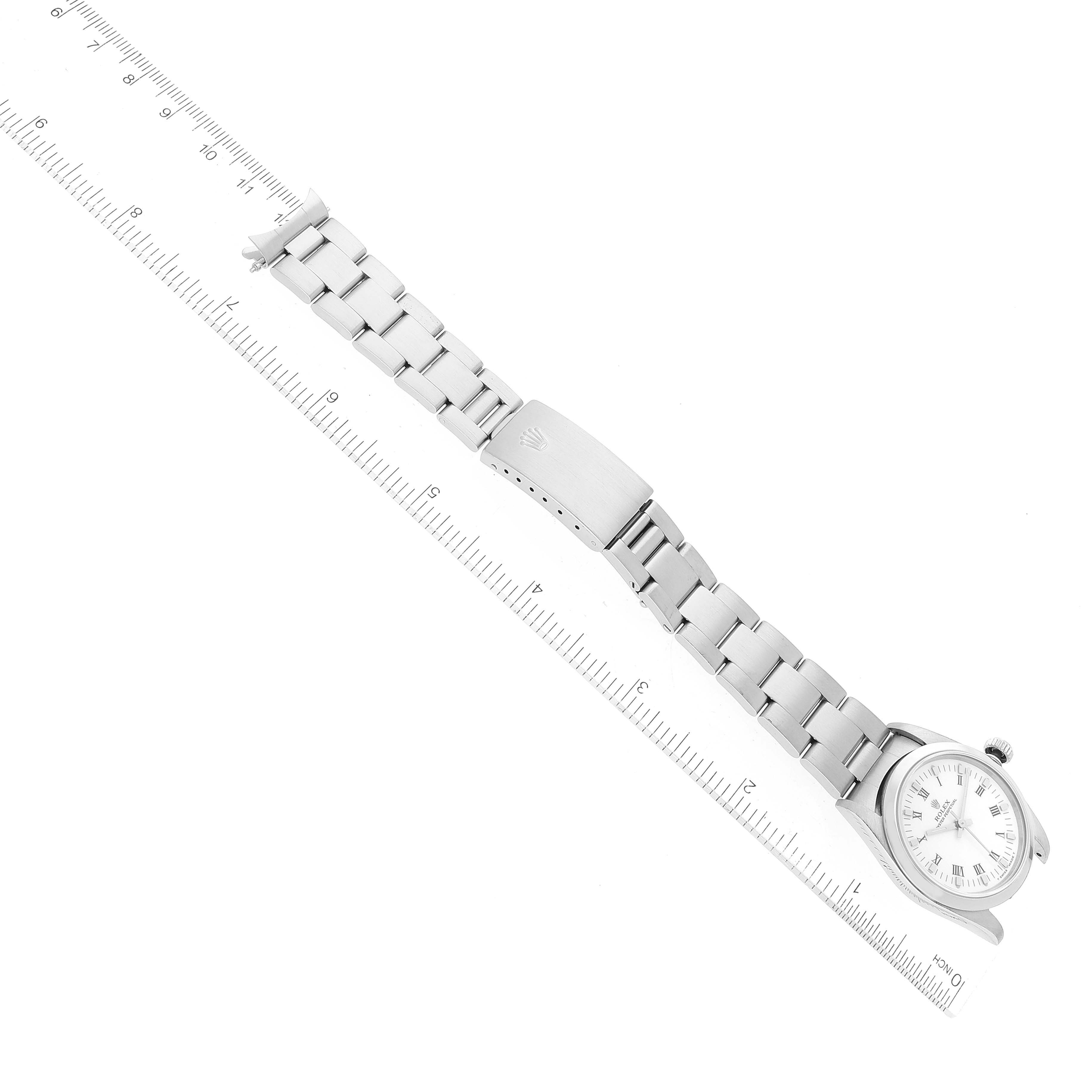 The image shows a top view of a Mid-Size Rolex watch, displaying its face, bracelet, and clasp.