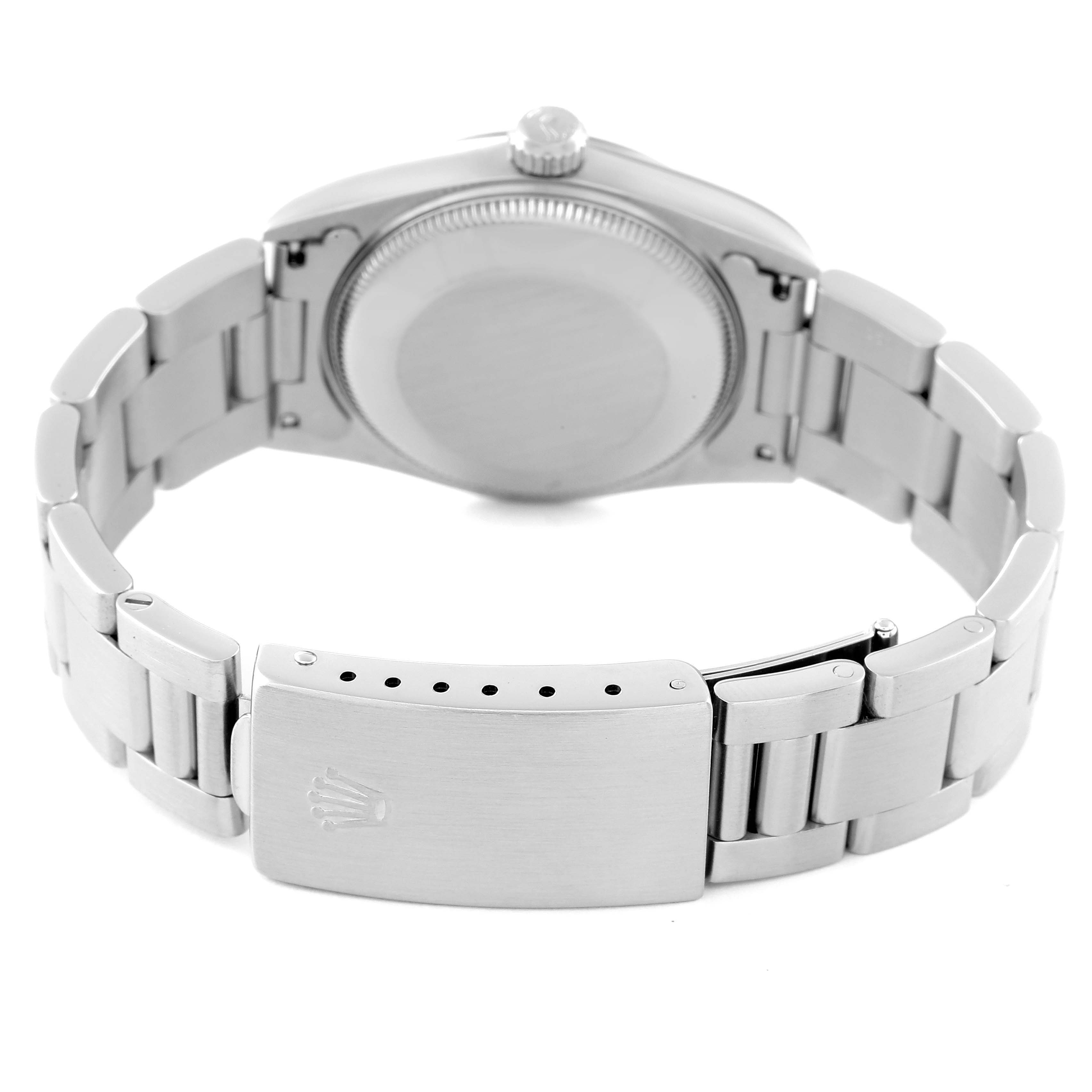 The image shows the back view of a Rolex Mid-Size 67480 Women
s Stainless Steel White Dial 67480 Women
s Stainless Steel White Dial watch, including the case back, bracelet, and claps with the Rolex logo.