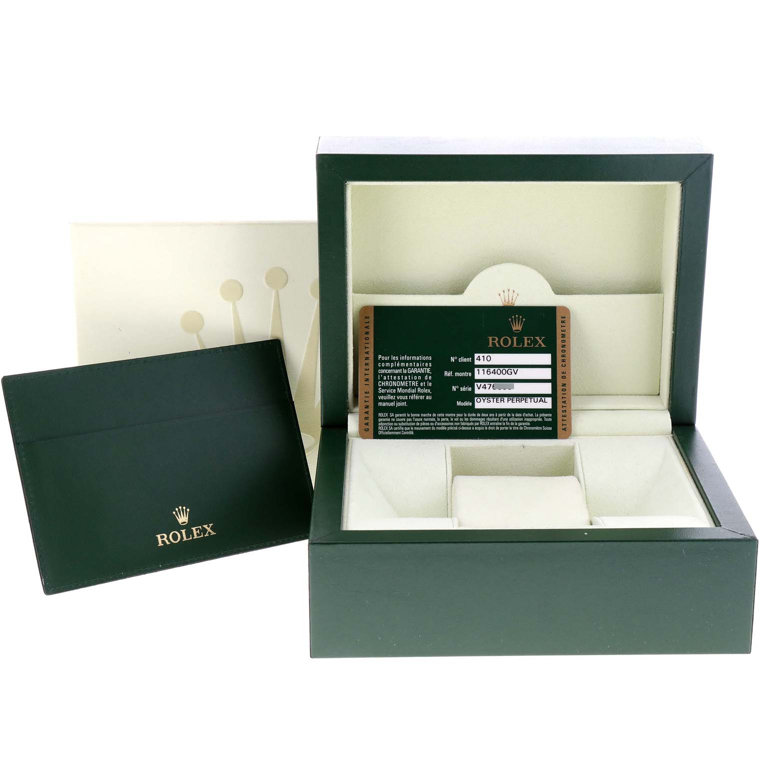 The image shows a Rolex Milgauss 116400V Men
s Stainless Steel Black Dial 116400V Men
s Stainless Steel Black Dial watch box and accessories, including the outer box, warranty card, and pouch.