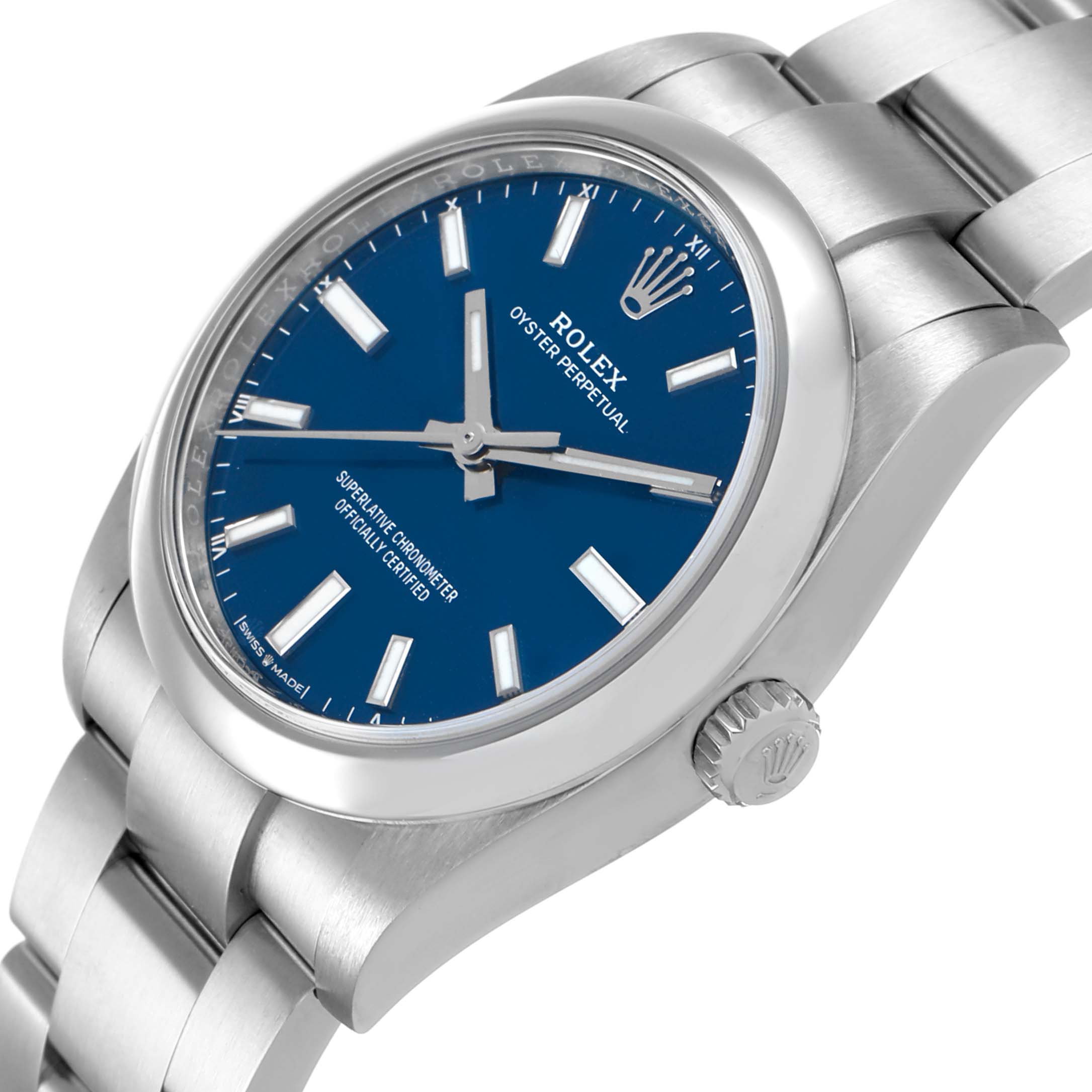 The image shows the Rolex Oyster Perpetual 124200 Men's Stainless Steel Blue Dial watch at a three-quarter angle, displaying the blue dial, bezel, crown, and bracelet.