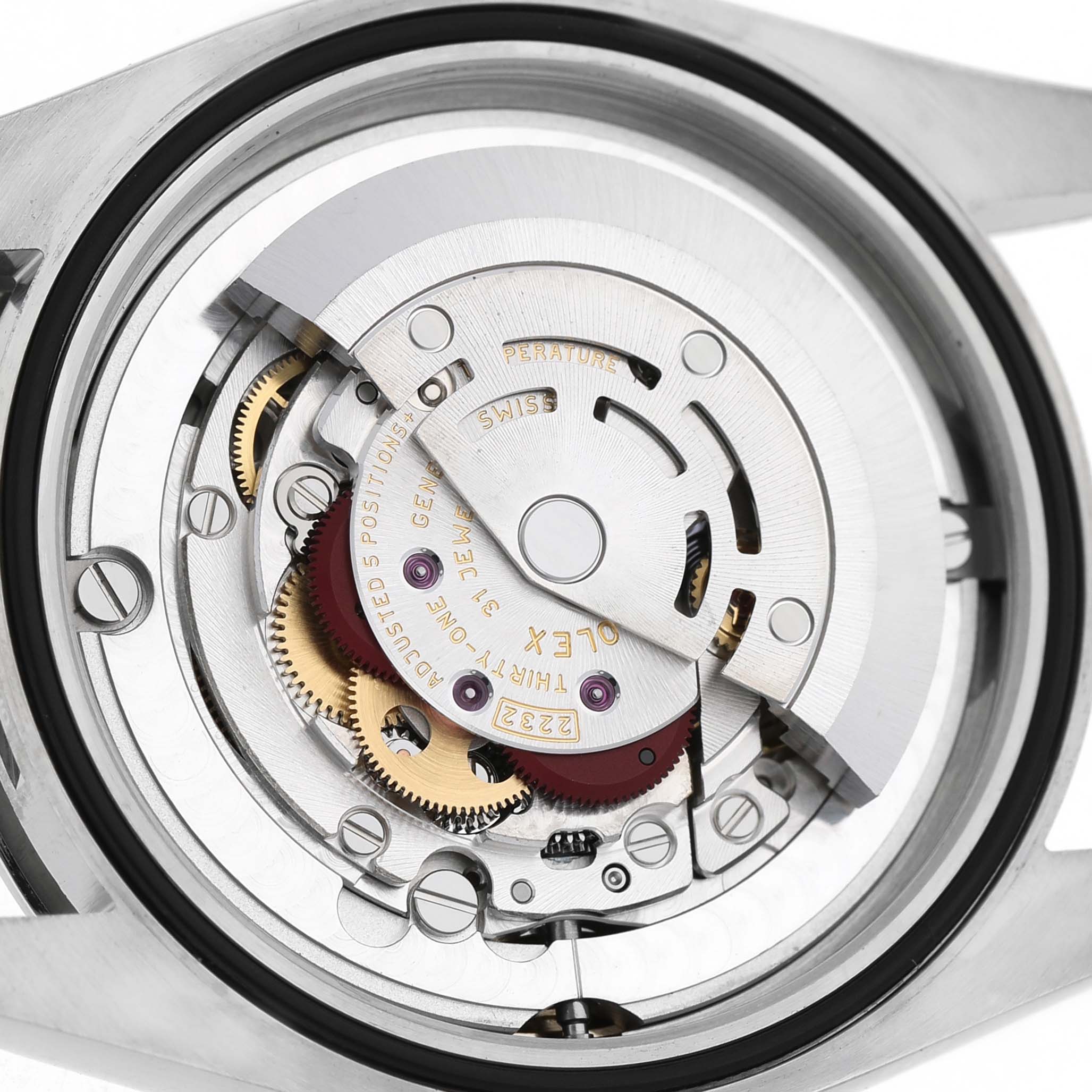 The image shows the intricate movement mechanism of the Rolex Oyster Perpetual 124200 Men's Stainless Steel Blue Dial from a rear angle.