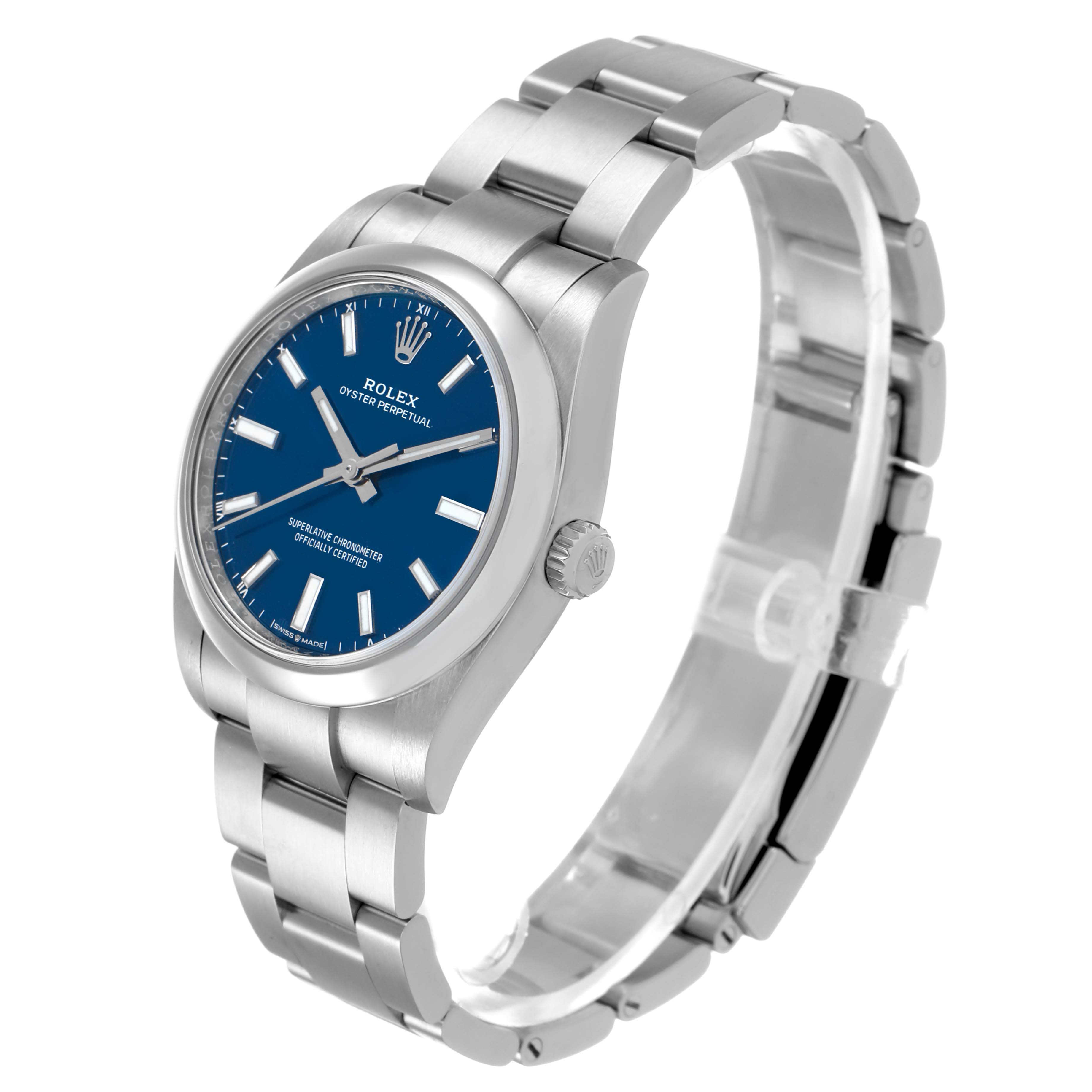 The Rolex Oyster Perpetual 124200 Men's Stainless Steel Blue Dial watch is shown at a three-quarter angle, highlighting the blue dial, case, bracelet, and crown.