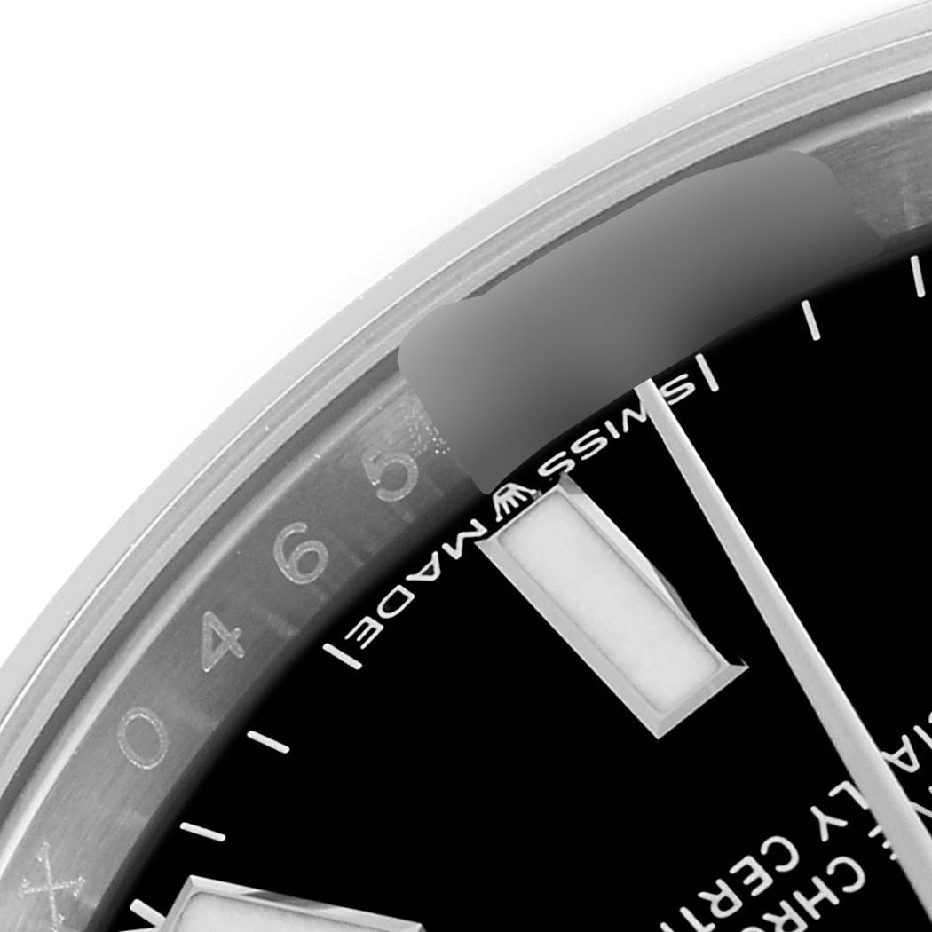 This close-up shot of a Rolex Oyster Perpetual 124200 Men
s Stainless Steel Black Dial 124200 Men
s Stainless Steel Black Dial watch shows the bezel, dial, and part of the "Swiss Made" inscription.