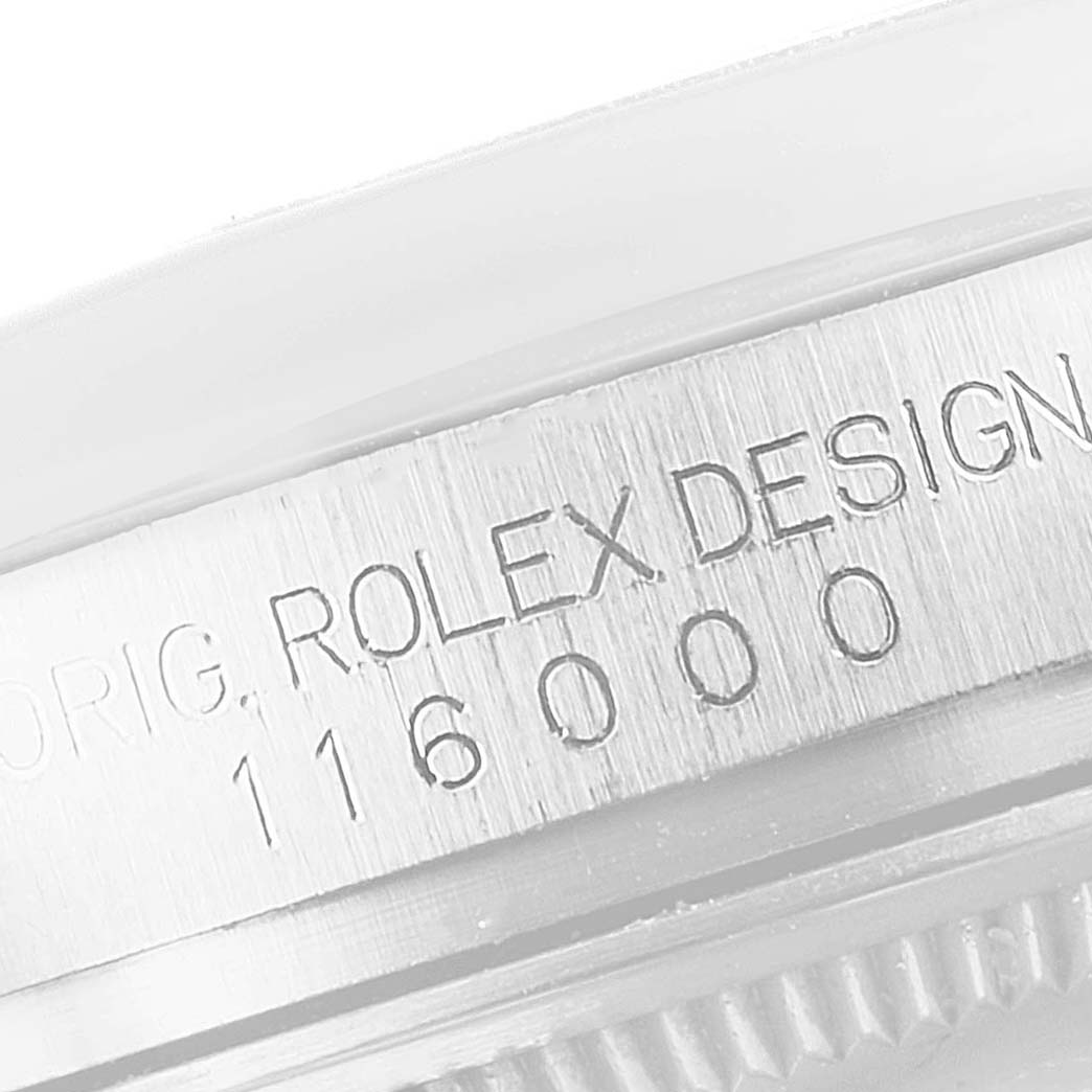 The image shows a close-up angle of the case side, featuring the model number "116000" and "Rolex Design" engraving on the Rolex Oyster Perpetual 116000 Men's Stainless Steel Silver Dial 116000 Men's Stainless Steel Silver Dial watch.