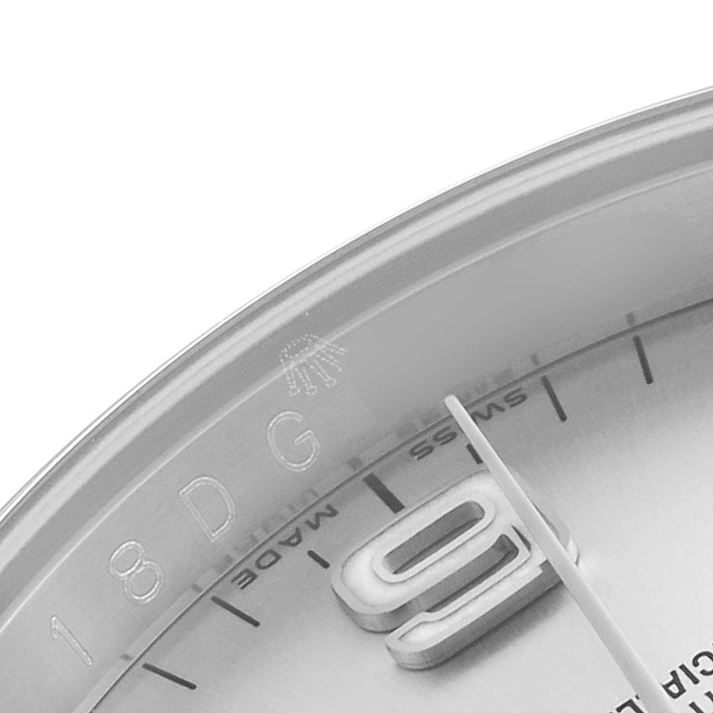 The image shows a close-up of the dial, bezel, and a partial hour mark of the Rolex Oyster Perpetual 116000 Men's Stainless Steel Silver Dial 116000 Men's Stainless Steel Silver Dial watch.