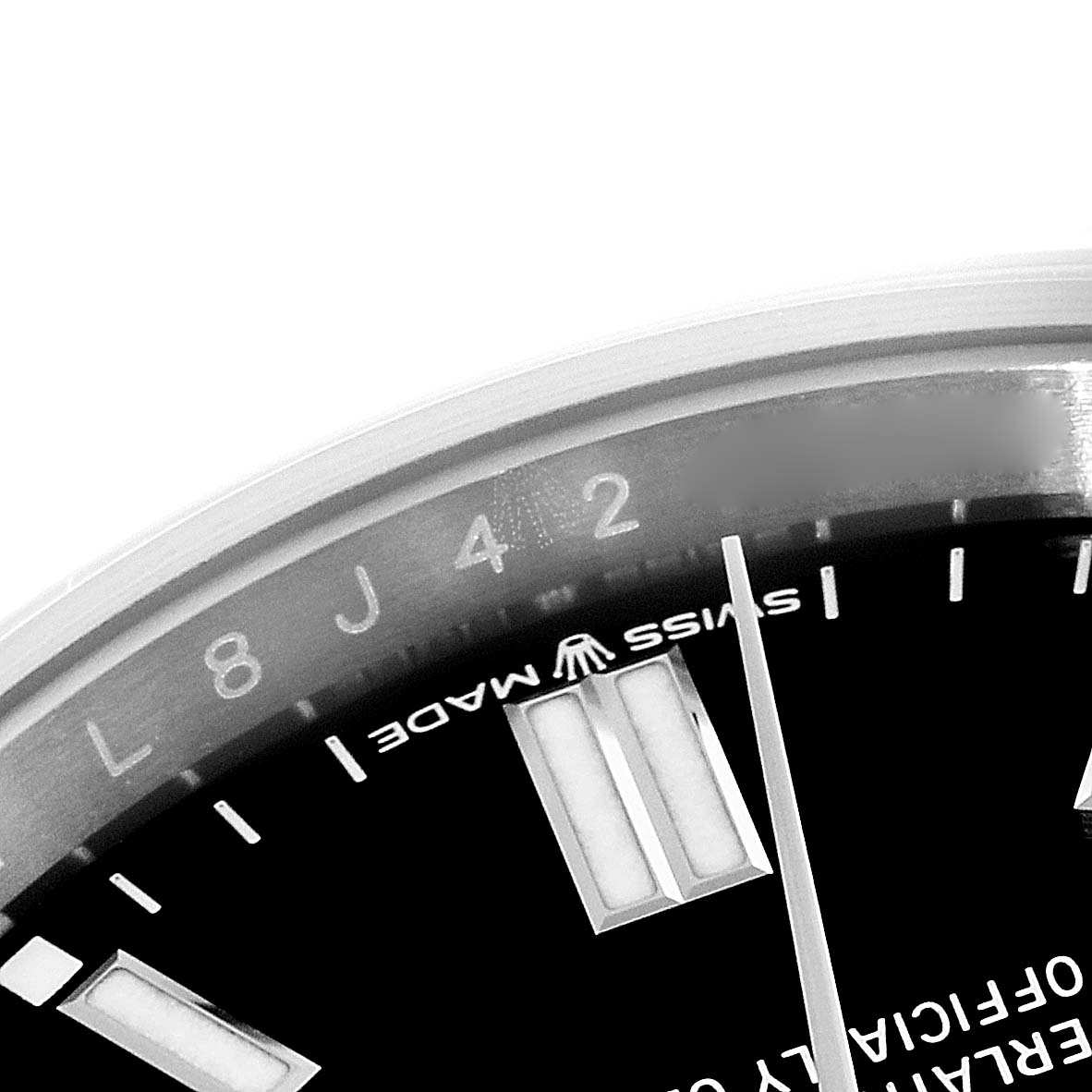 The image shows a close-up of the dial and bezel of a Rolex Oyster Perpetual 126000 Men's Stainless Steel Black Dial 126000 Men's Stainless Steel Black Dial watch, highlighting the "Swiss Made" text.