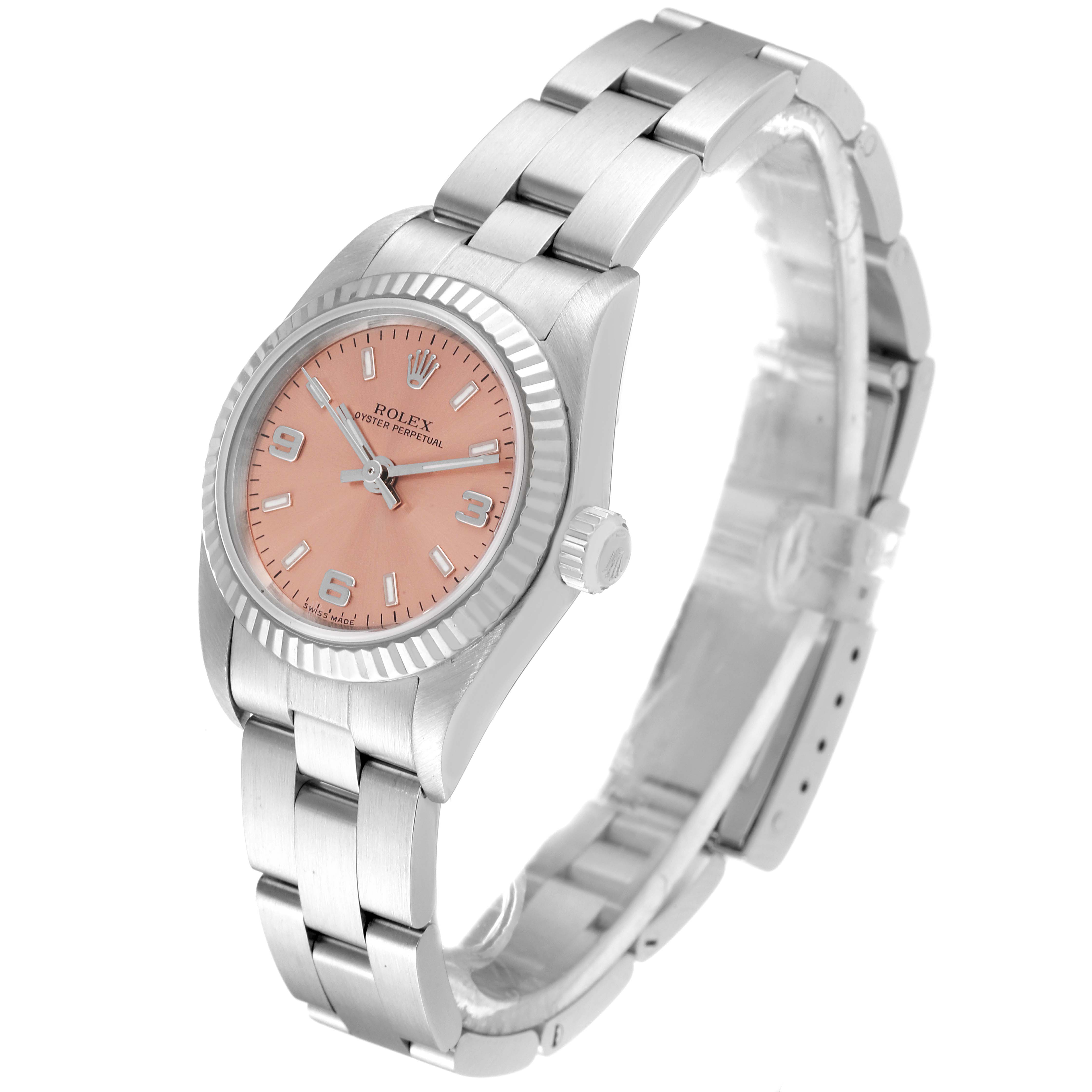 This image shows a Rolex Oyster Perpetual 76094 Women
s Stainless Steel Pink Dial 76094 Women
s Stainless Steel Pink Dial watch angled from the front-left, displaying its dial, bezel, and bracelet.