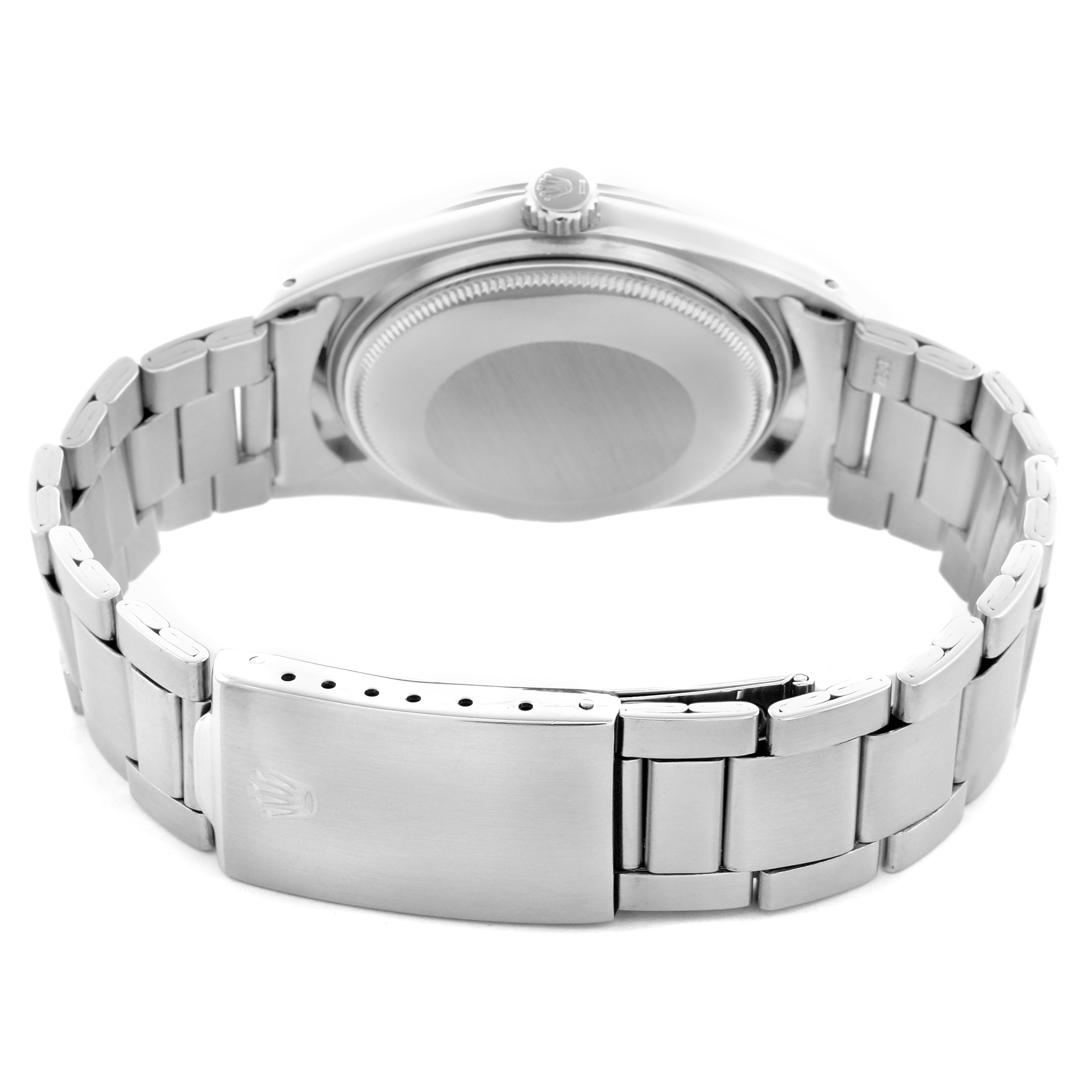 The Rolex Vintage Collection 1018 Men's Stainless Steel Silver Dial 1018 Men's Stainless Steel Silver Dial watch is shown from the back, highlighting the clasp, case back, bracelet, and crown.