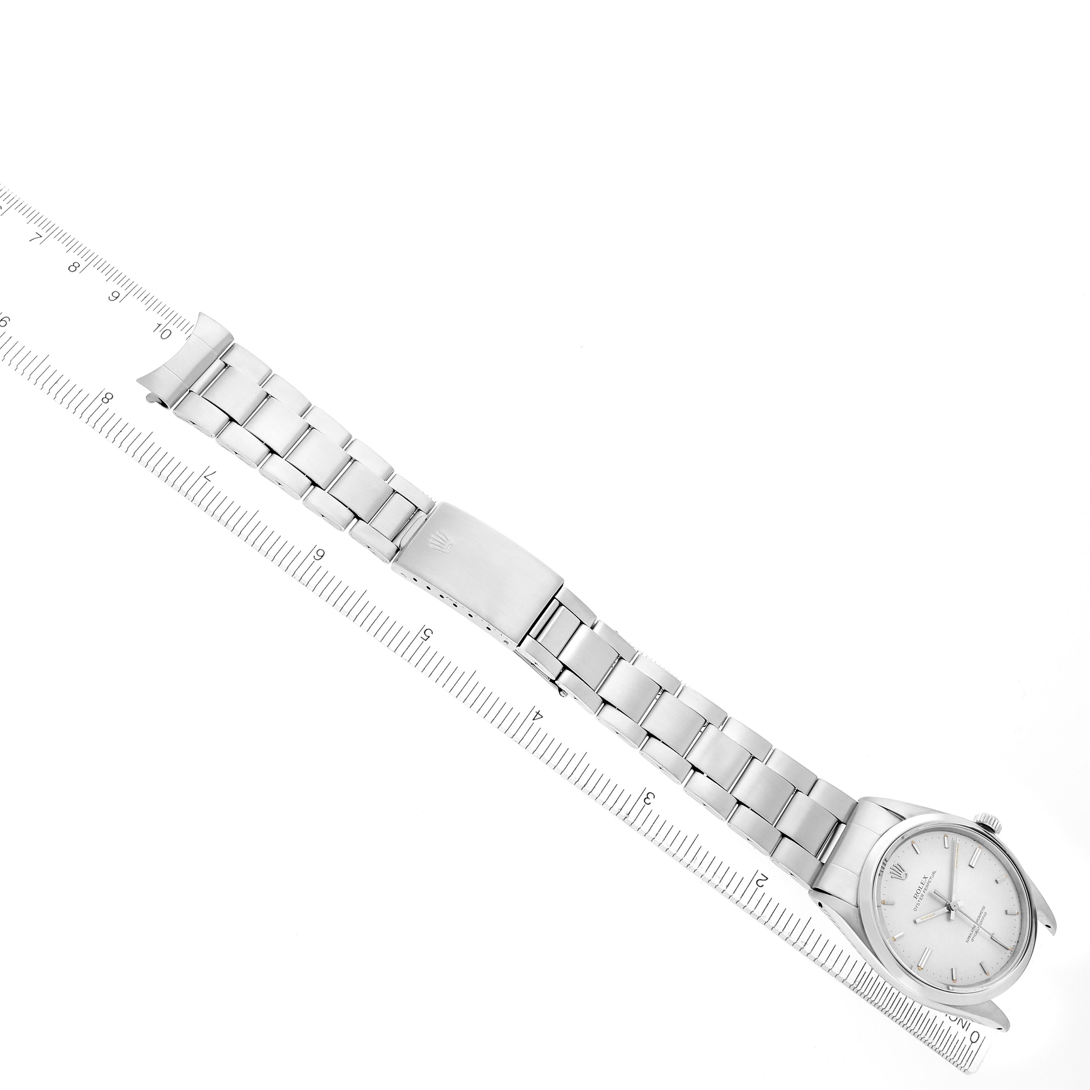 The image shows a Rolex Vintage Collection 1018 Men's Stainless Steel Silver Dial 1018 Men's Stainless Steel Silver Dial watch laid flat, displaying the face, bracelet, and clasp alongside a ruler.