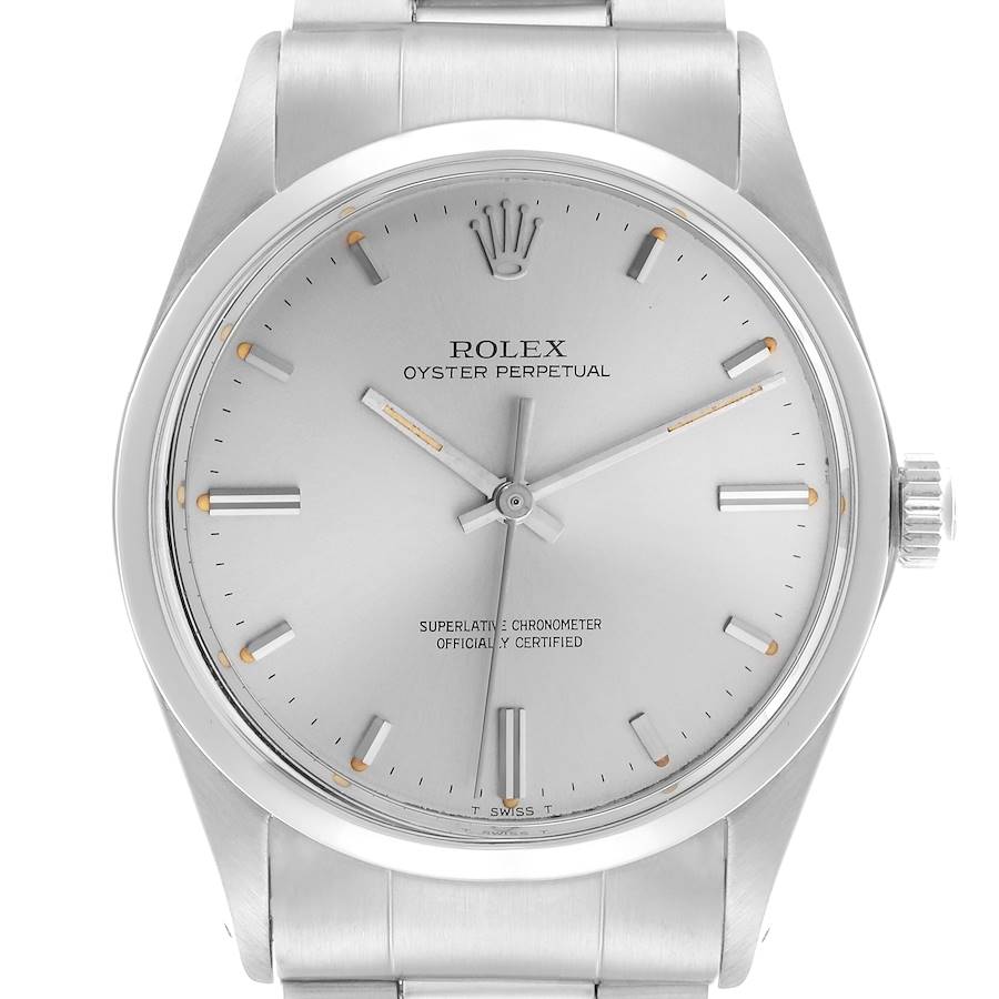 The Rolex Vintage Collection watch is shown from a top view, displaying the dial, hands, and metal bracelet.