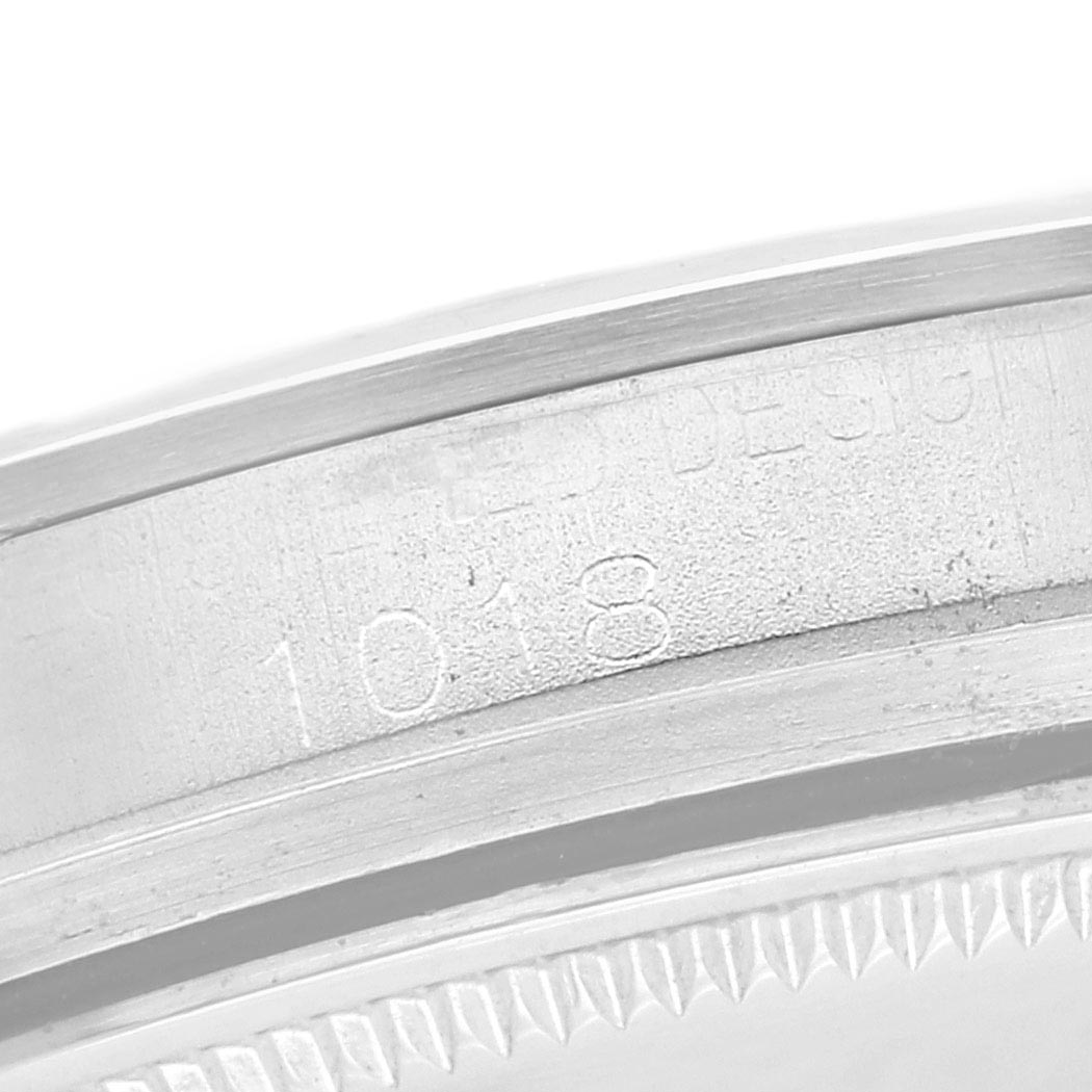 The image shows a close-up of the engraved inner bezel with model number for a Rolex Vintage Collection 1018 Men's Stainless Steel Silver Dial 1018 Men's Stainless Steel Silver Dial watch.