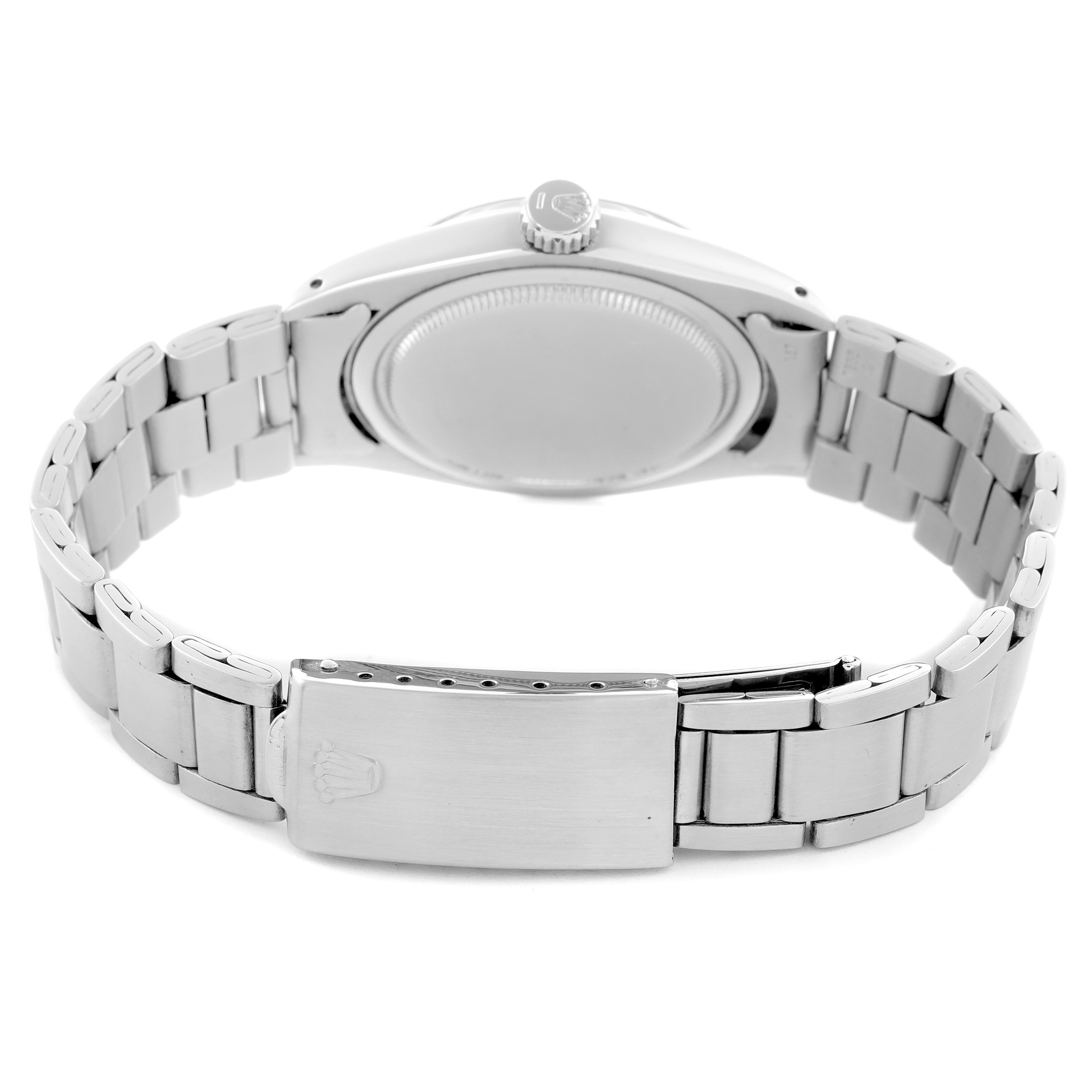 The image shows the back view of a Rolex Vintage Collection 6427 Men
s Stainless Steel Silver Dial 6427 Men
s Stainless Steel Silver Dial watch, highlighting the clasp, bracelet, and case back.