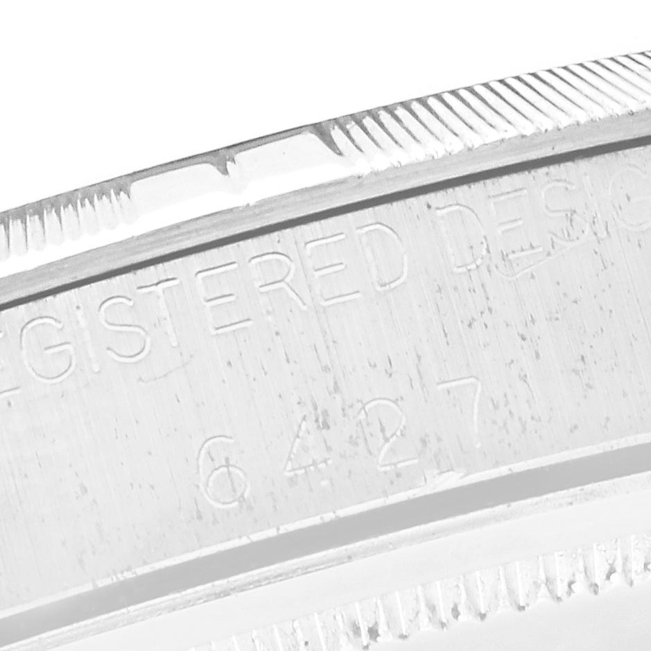 The image shows a close-up of the engraved side detailing on the Rolex Vintage Collection 6427 Men
s Stainless Steel Silver Dial 6427 Men
s Stainless Steel Silver Dial watch.