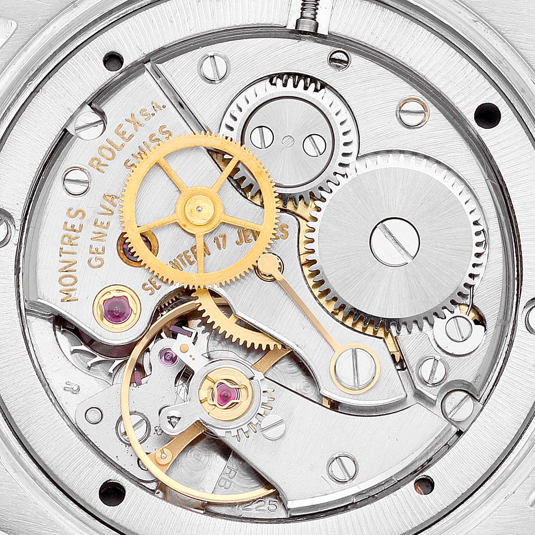 This image shows a close-up view of the mechanical movement inside a Rolex Date 6694 Men's Stainless Steel Black Dial 6694 Men's Stainless Steel Black Dial model watch, highlighting gears and intricate parts.
