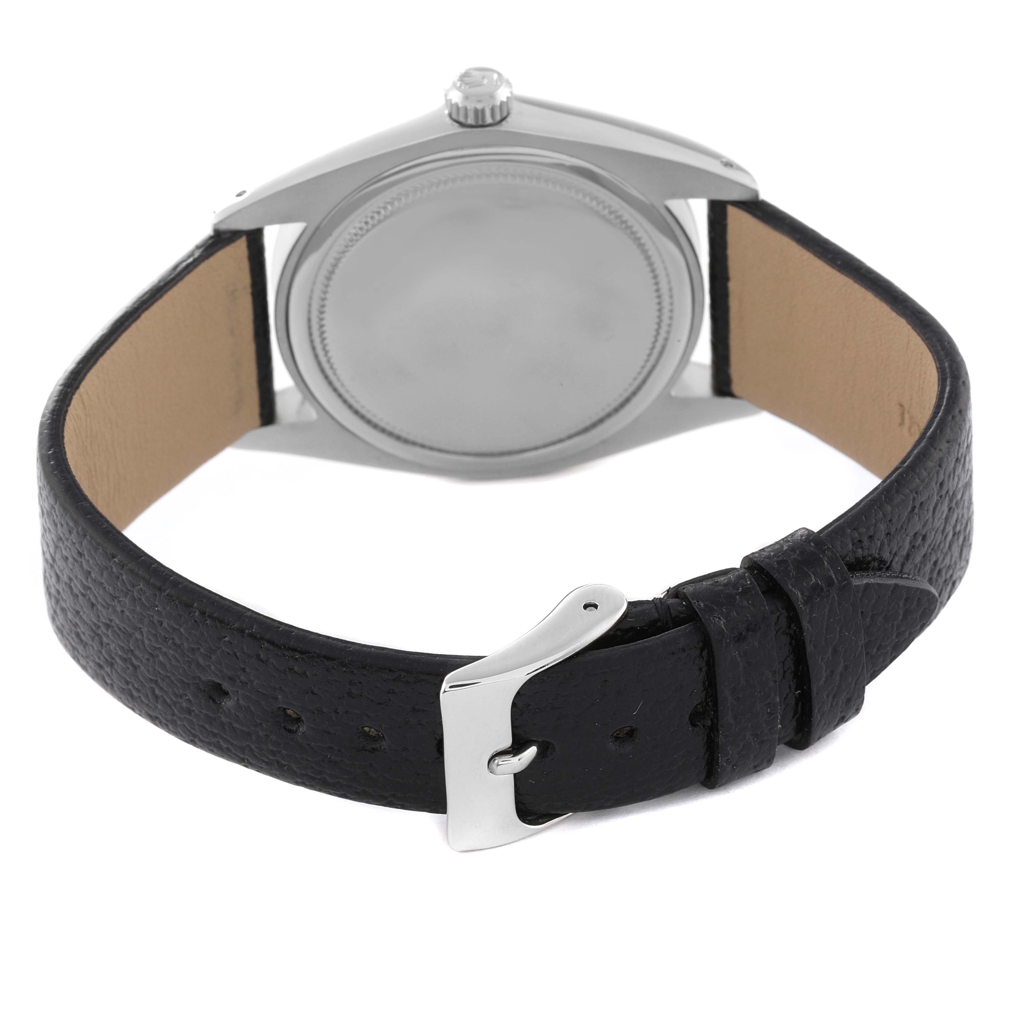 This image shows the back view of a Rolex Date 6694 Men's Stainless Steel Black Dial 6694 Men's Stainless Steel Black Dial model watch with its leather strap and buckle visible.