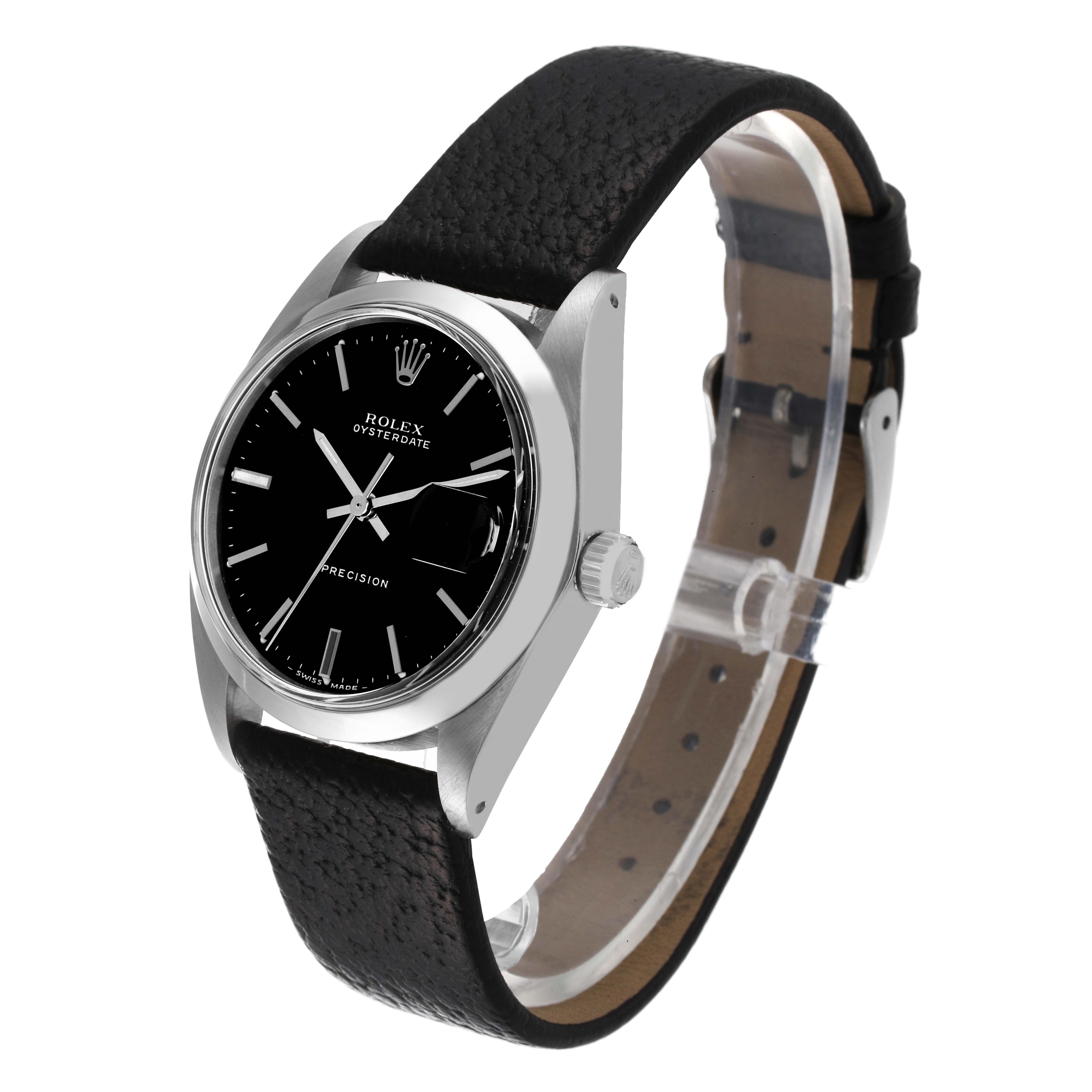 The image shows a Rolex Oysterdate Precision watch at an angle showcasing the dial, case, and black leather strap.