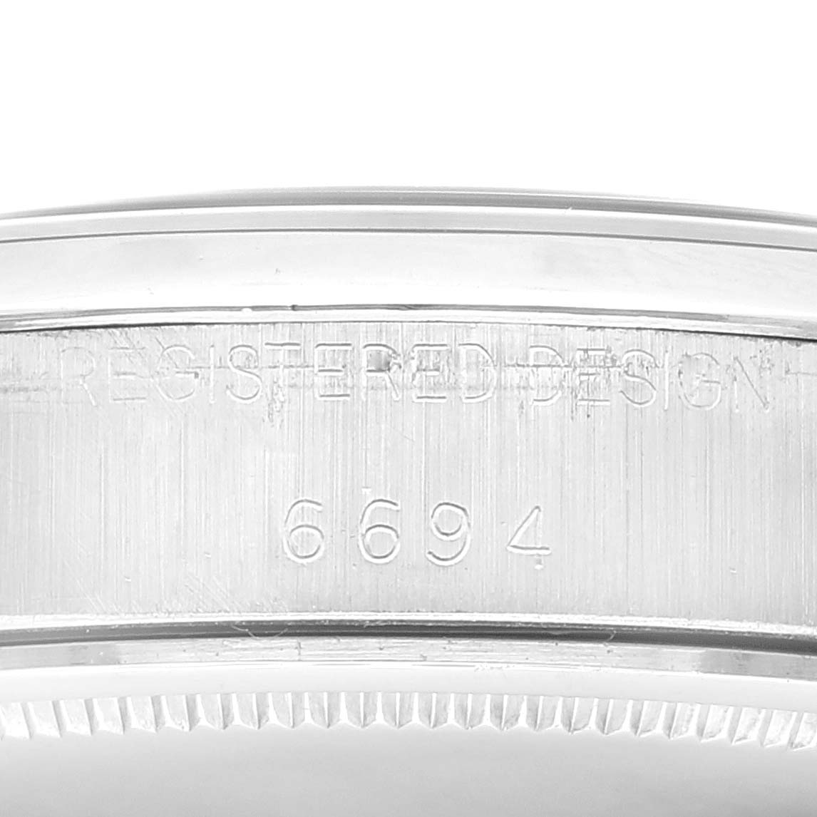 The image shows a close-up view of the side of a Vintage Collection Rolex watch, highlighting its engraved model number "6694".