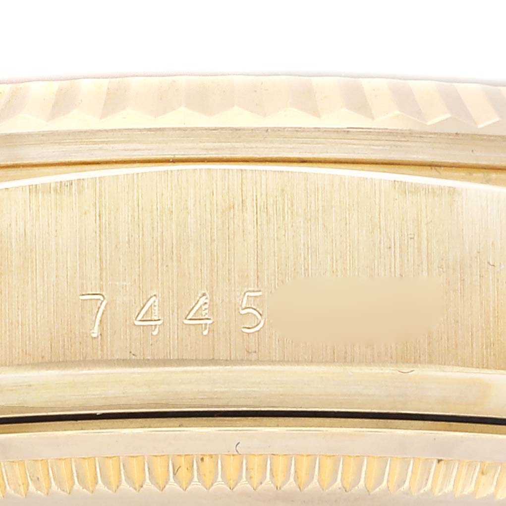 This image shows a close-up of the case back and serial number of a Rolex President 18038 Men's Yellow Gold Champagne Dial 18038 Men's Yellow Gold Champagne Dial model watch.